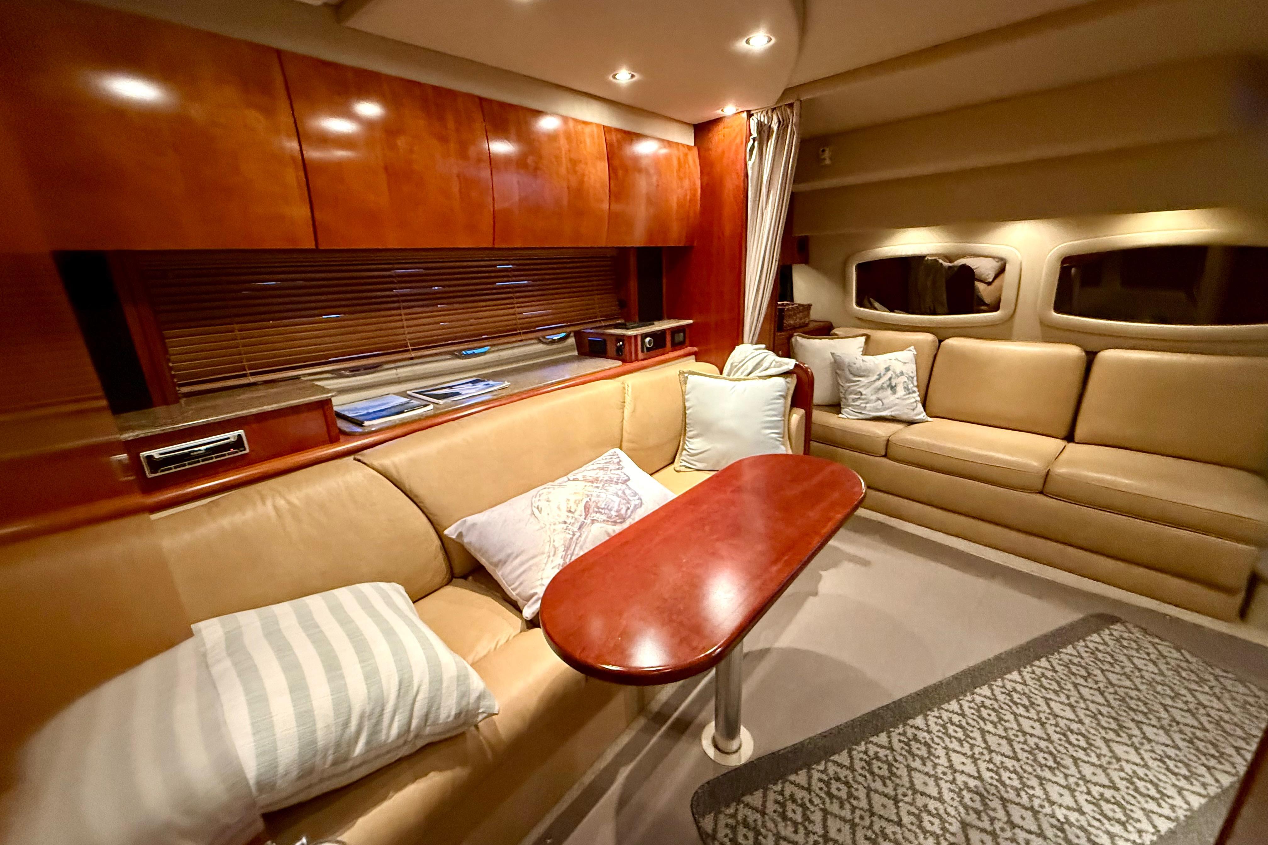 Luxurious interior of 2011 Cruisers Yachts 390 Sports Coupe with plush seating and elegant wood finishes.