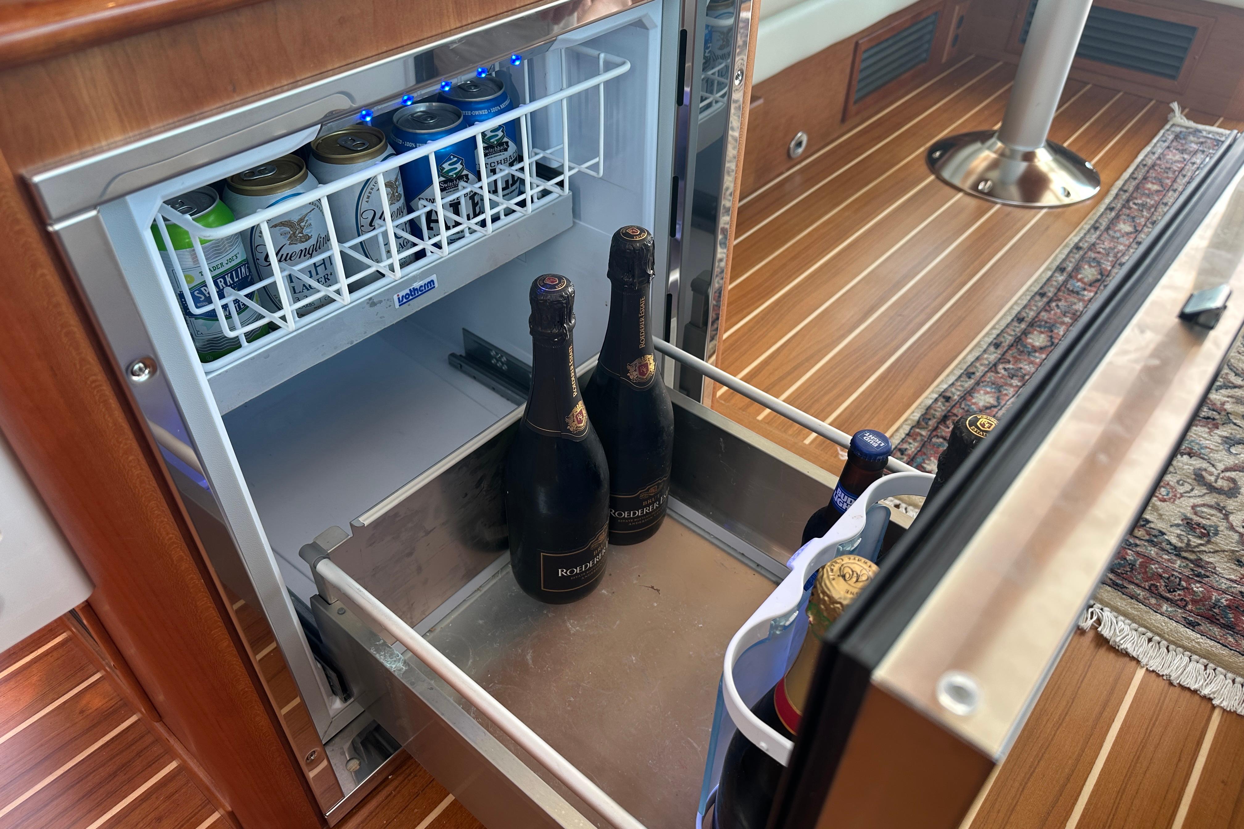 Mini fridge with drinks inside the 2025 Sabre 48 Salon Express yacht.