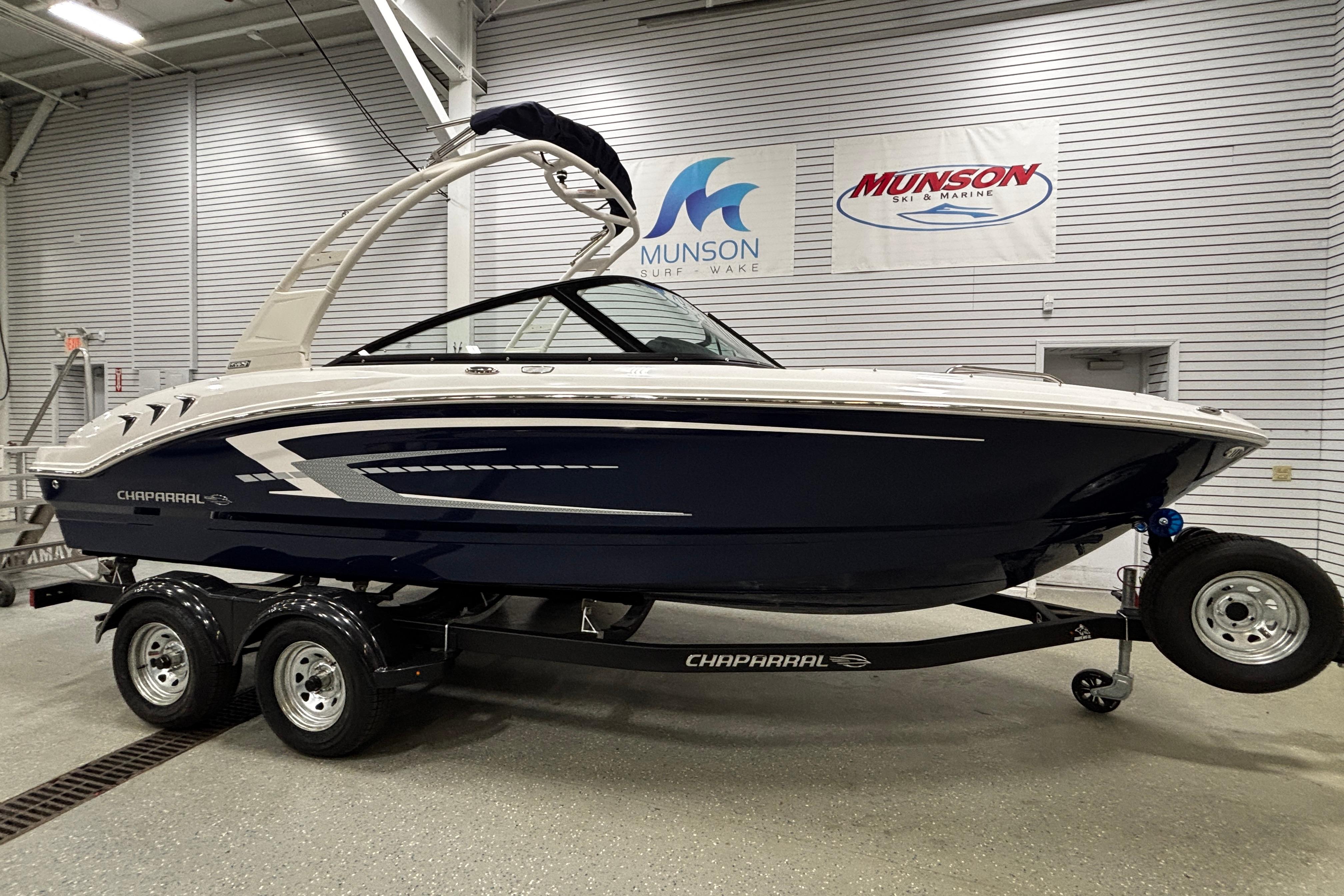 2026 Chaparral 21 SSi boat on trailer in showroom, Munson Ski & Marine.