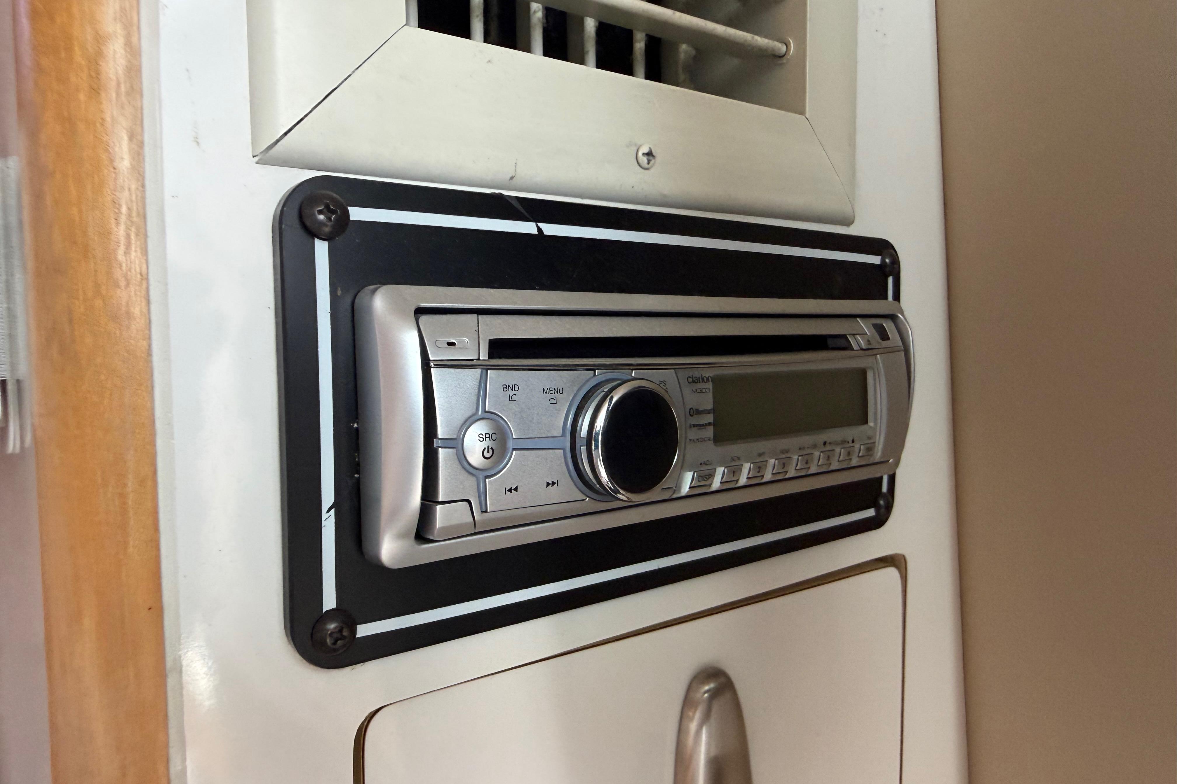 1999 Chaparral Signature 300 boat stereo system with control panel and air vent.