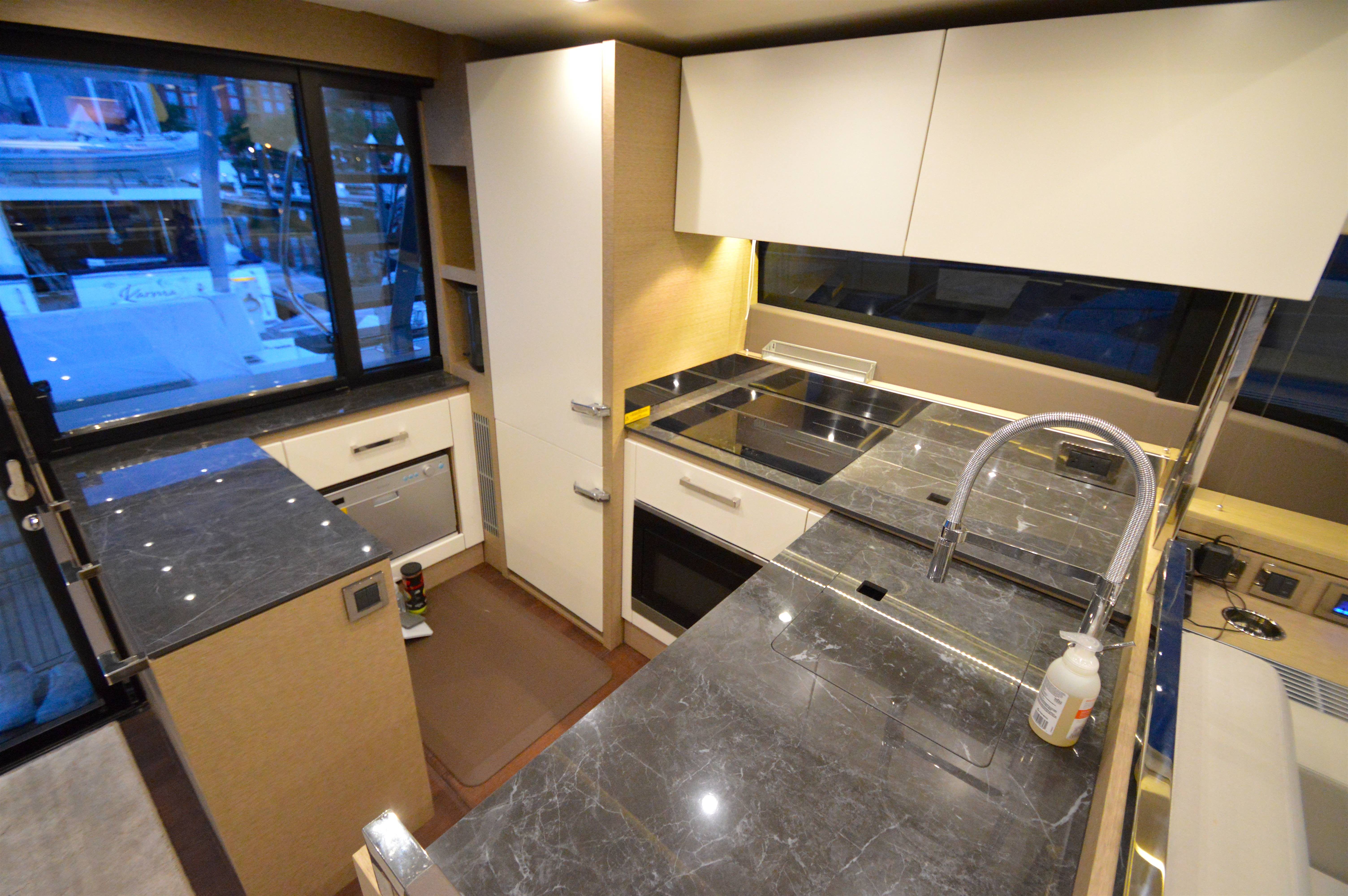 Modern kitchen on a 2017 Prestige 630 yacht.