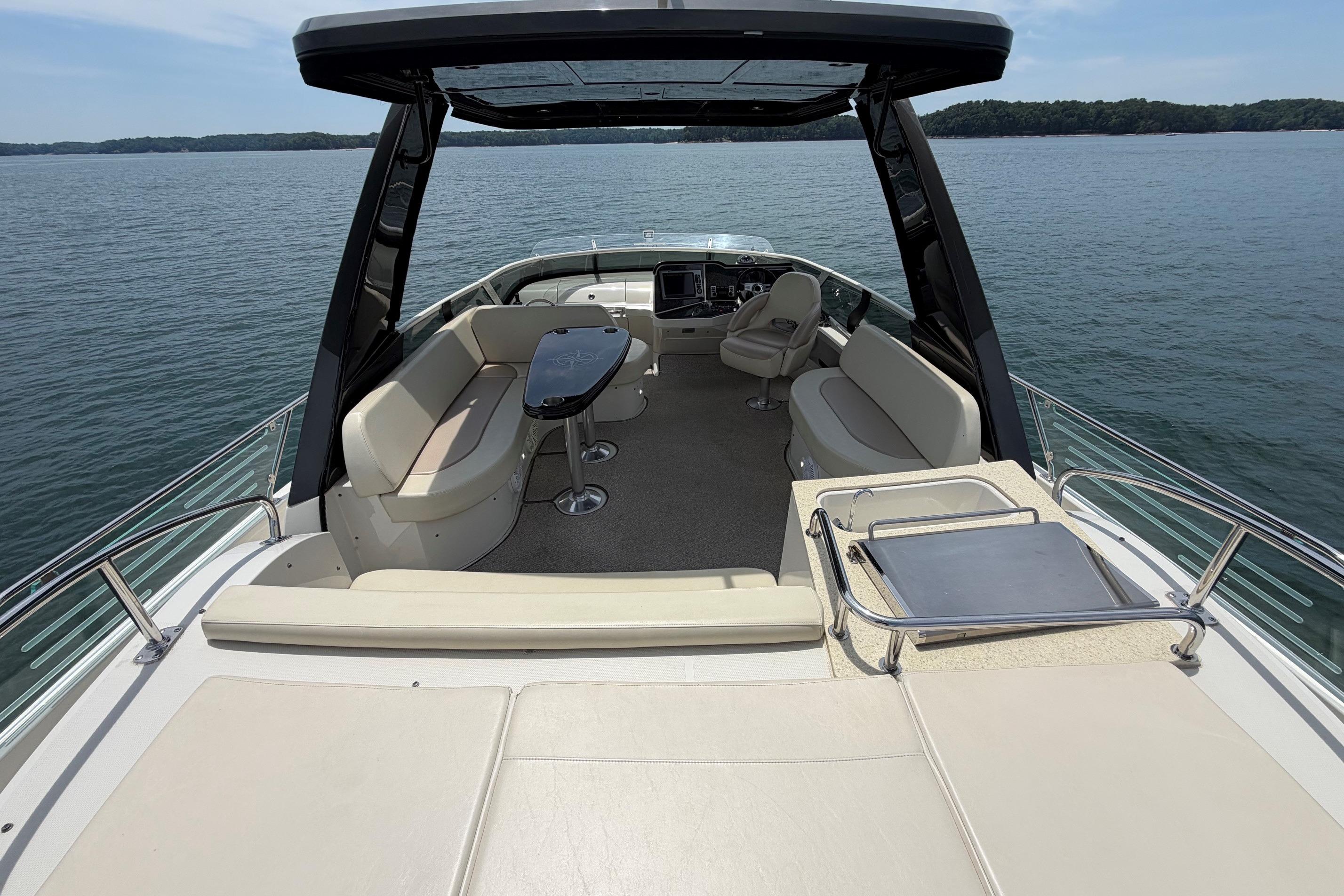 Luxurious 2011 Carver 44 Sojourn yacht interior with spacious seating and sleek design.