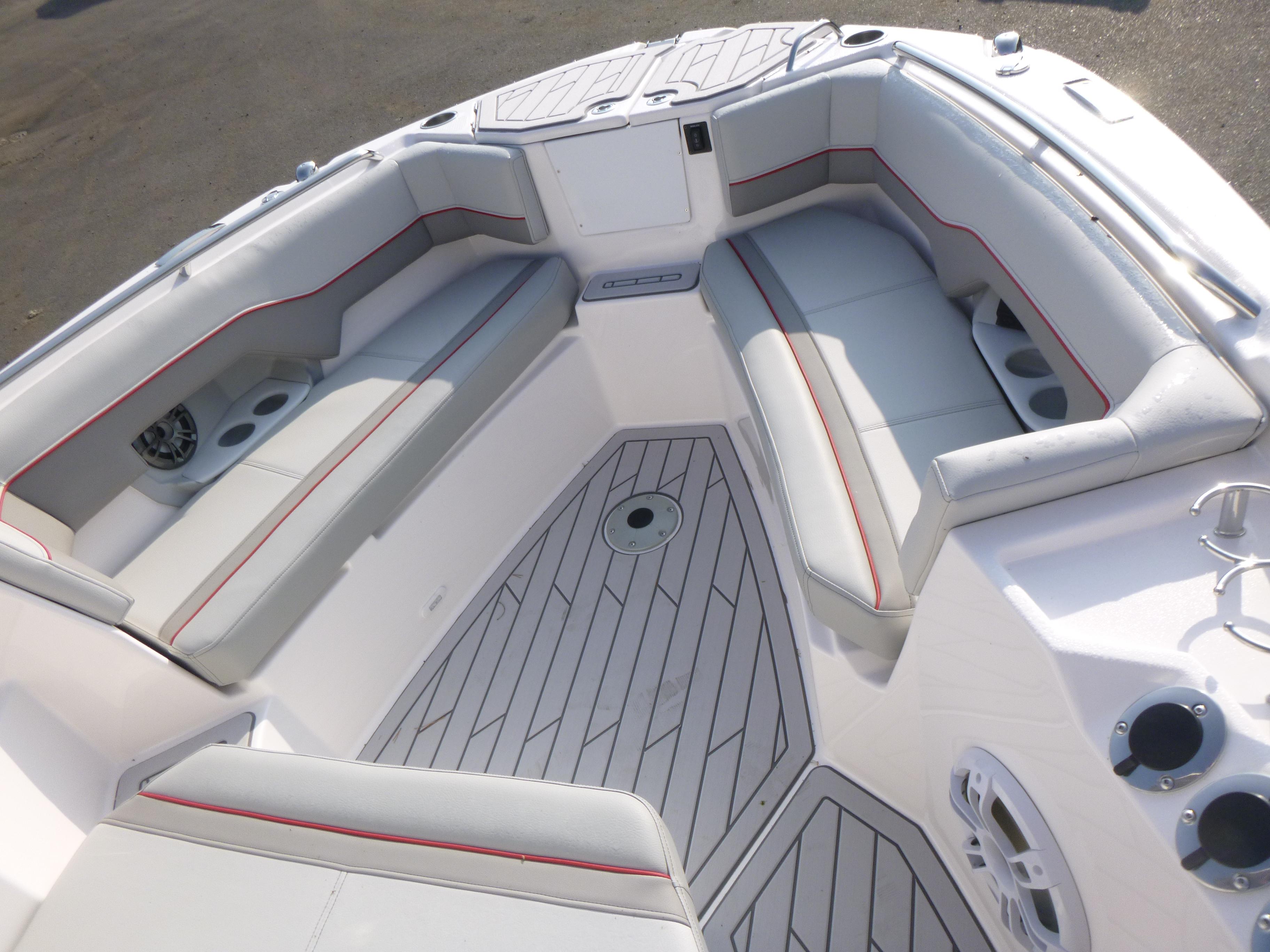 Luxurious seating area on 2025 Solara S-250 CW boat with modern design and cup holders.