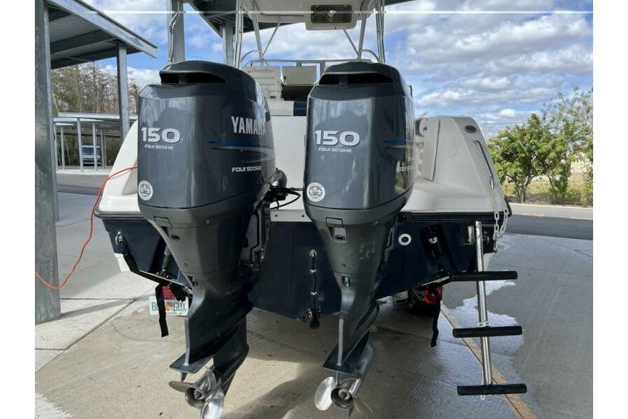 2006 Century 2400 Walk-Around boat with twin Yamaha 150 four-stroke engines.