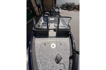 2026 Tracker Pro Guide V-16 WT boat interior with steering console and seating.