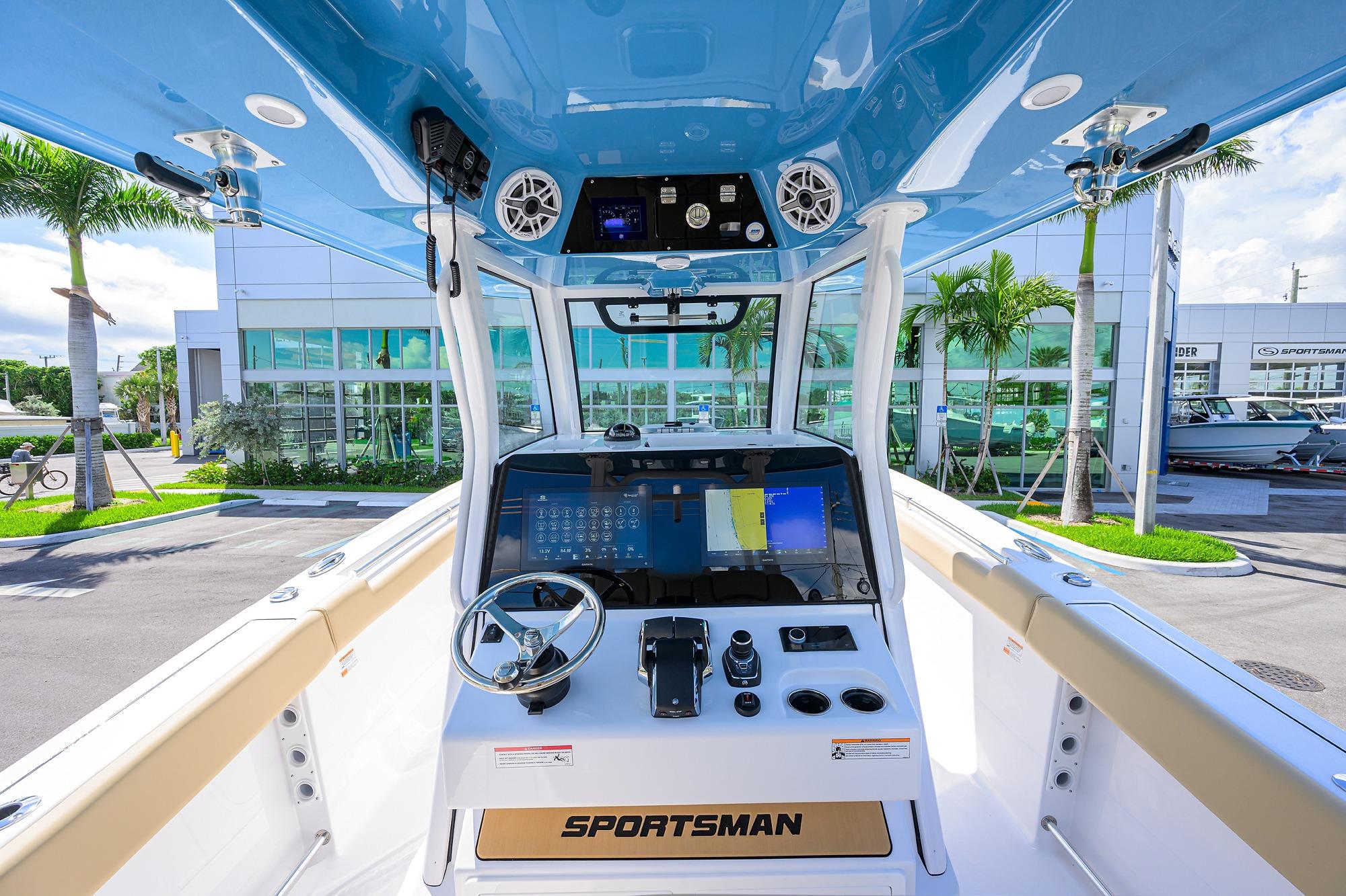 2026 Sportsman Open 302 Center Console boat interior with modern dashboard and steering wheel.