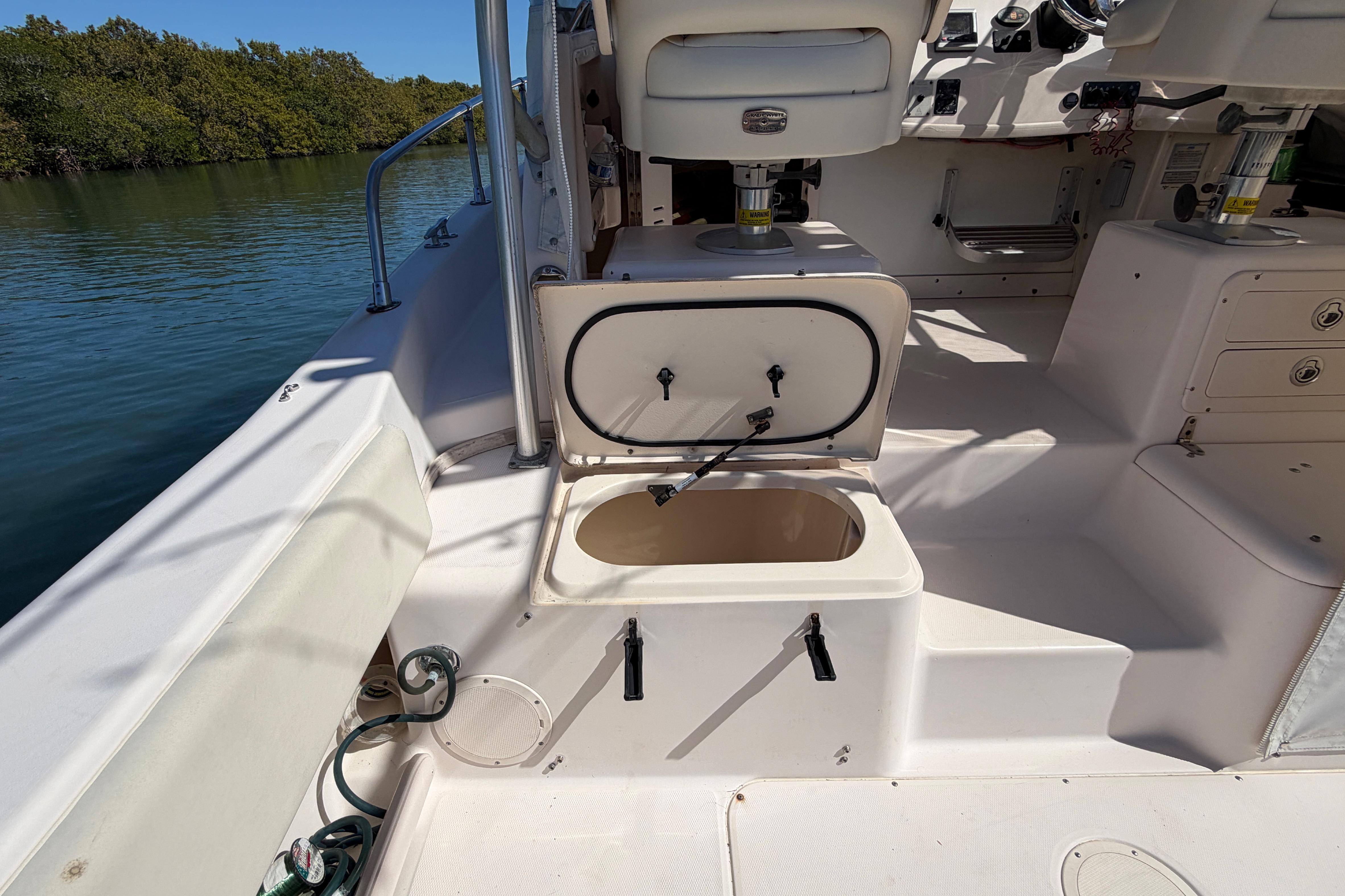 2006 Grady-White Sailfish 282 boat interior with open storage compartment.
