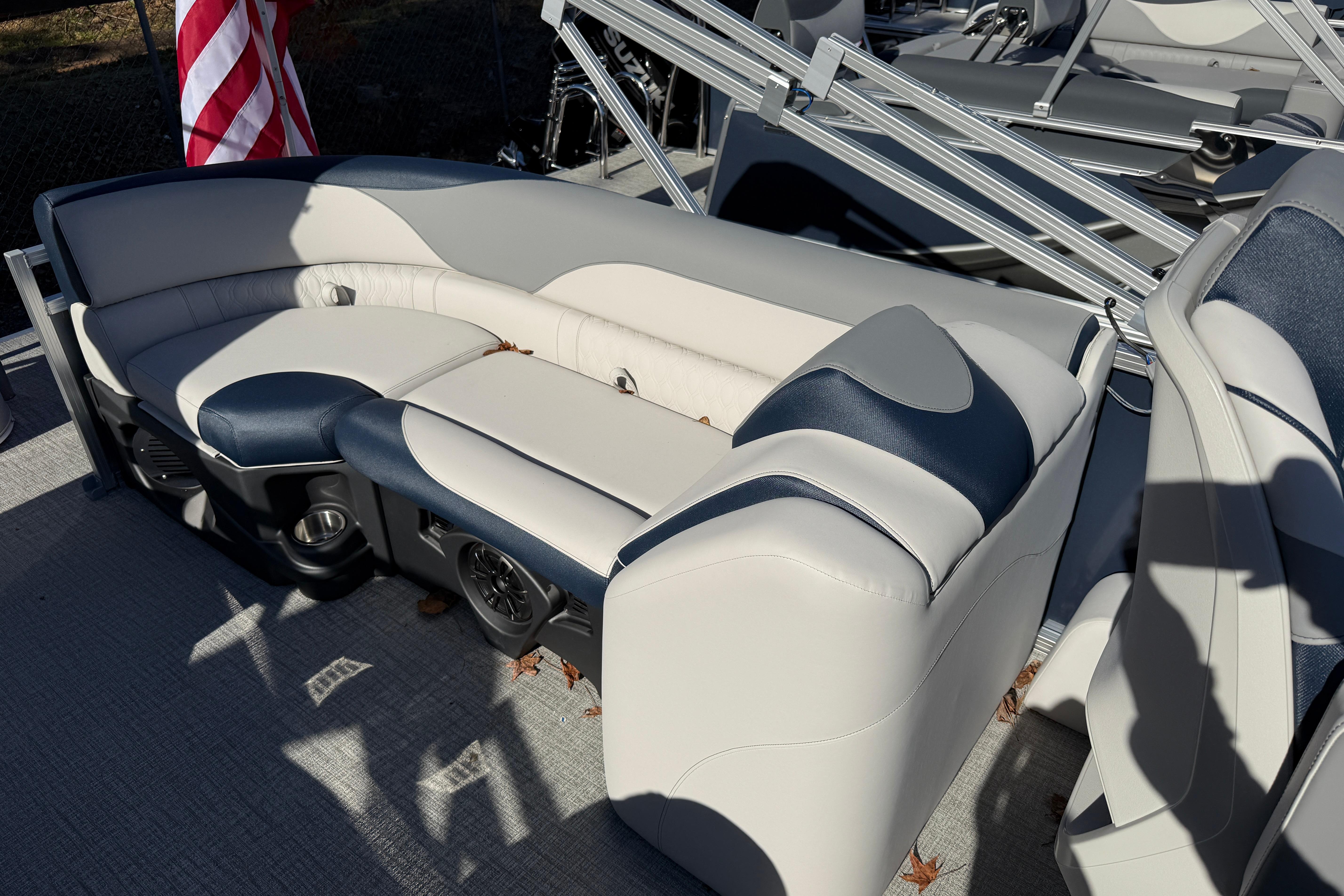 2026 Tahoe Pontoon LTZ Quad Lounger with plush seating and American flag.