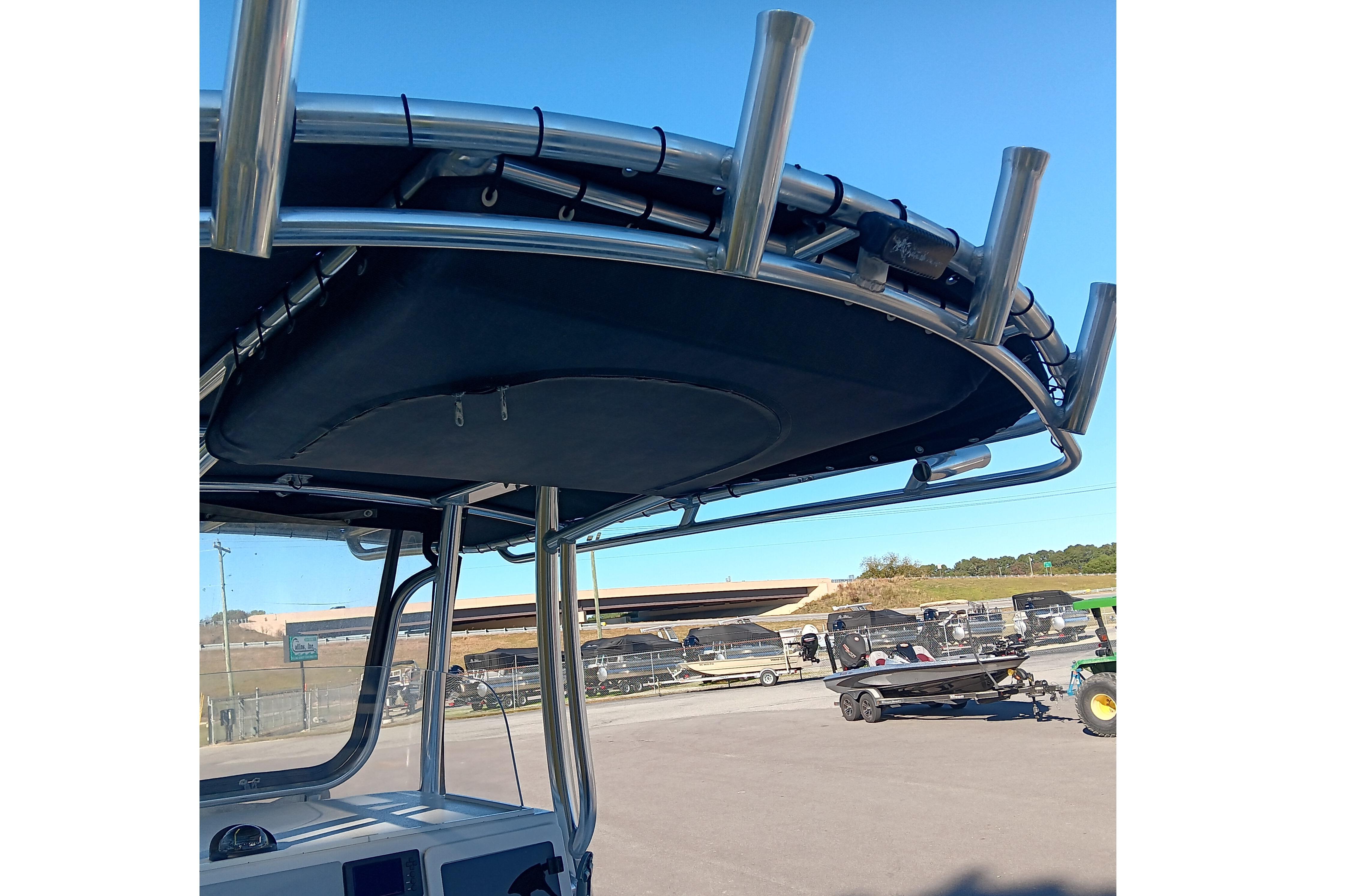 2016 Parker 2300 Special Edition boat with T-top and rod holders.