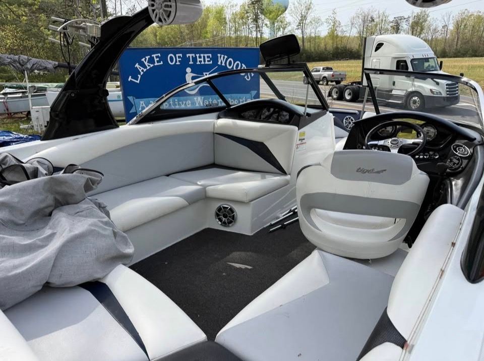 Interior of a 2010 Tigé Z1 boat with white upholstery.