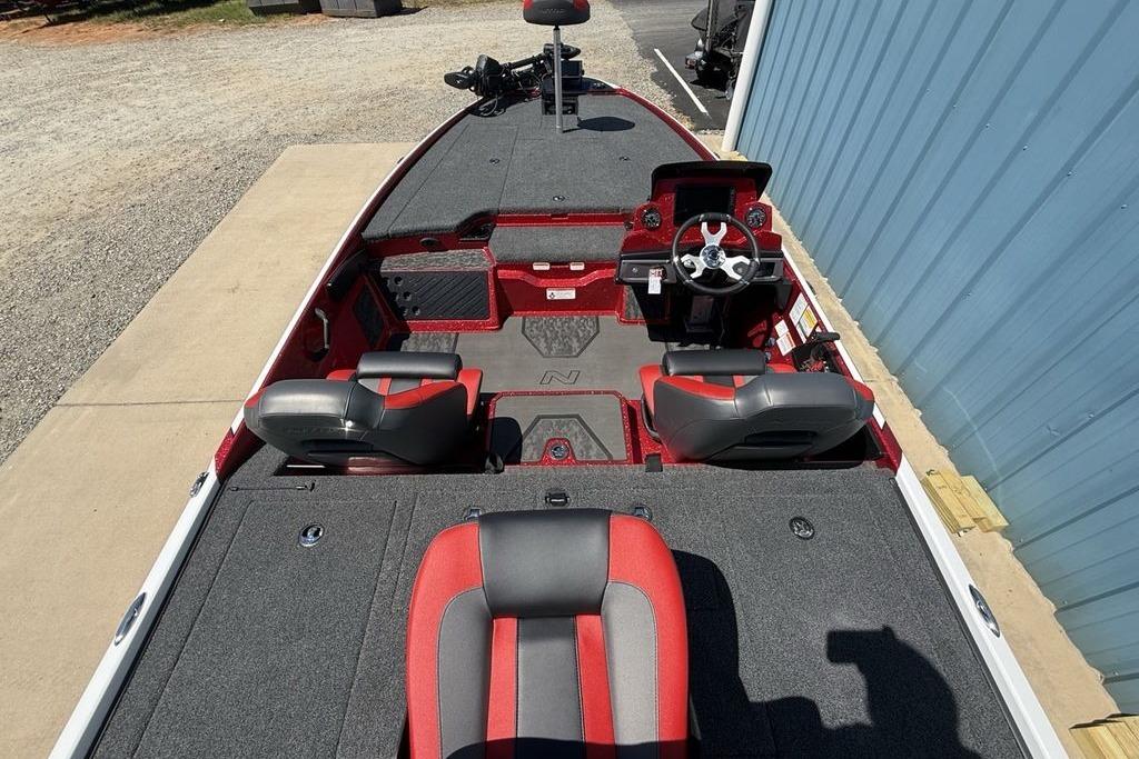 2026 Nitro Z20 XL Pro boat interior with red and gray seating, steering console.