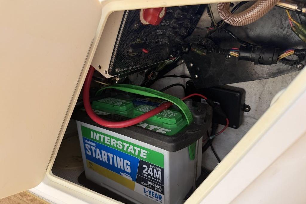 Battery compartment of a 2012 Chaos 16 Bonefish boat with Interstate marine battery.