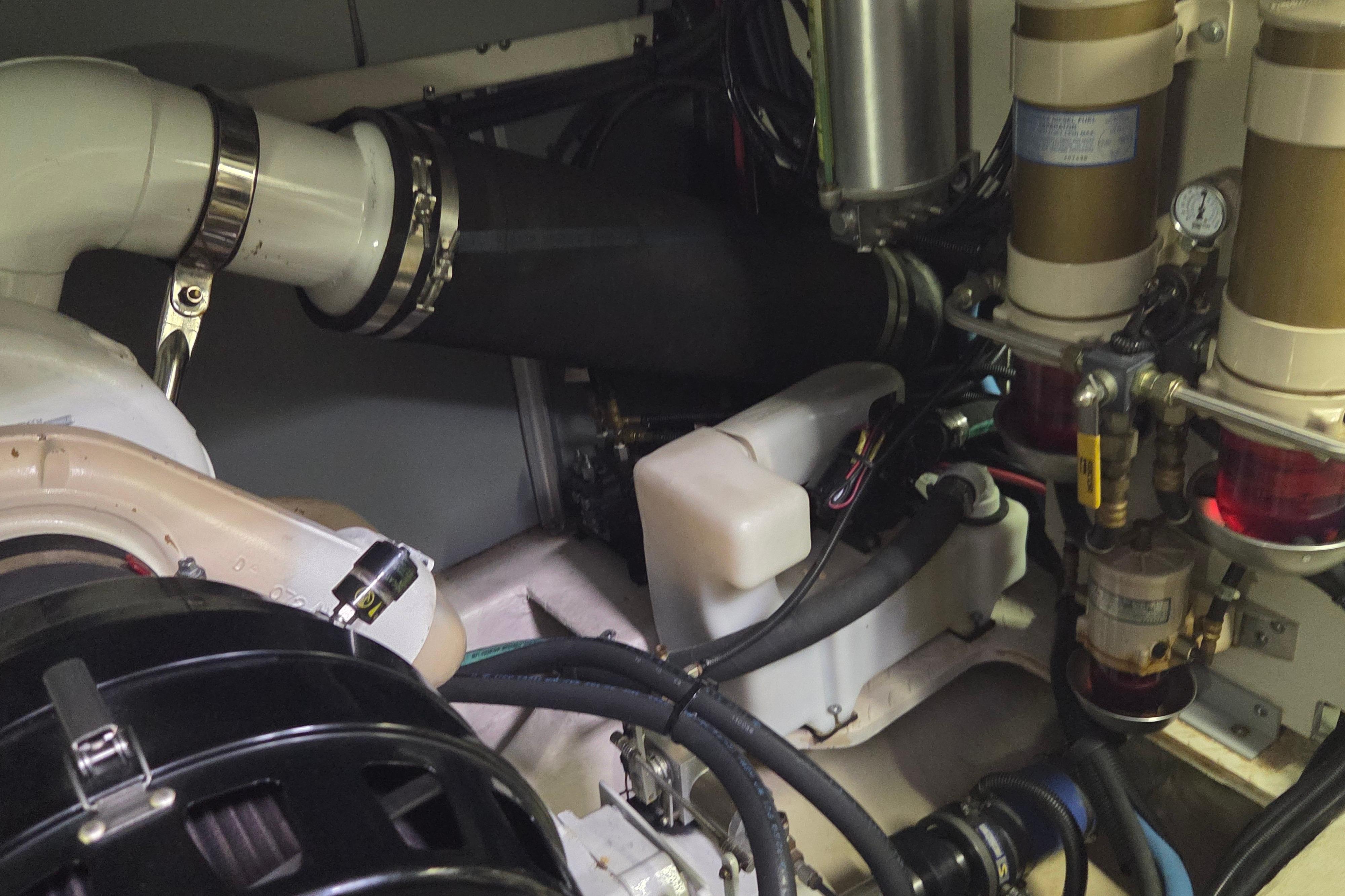Engine room of a 2000 Sea Ray Sundancer 540 yacht, showcasing mechanical components.