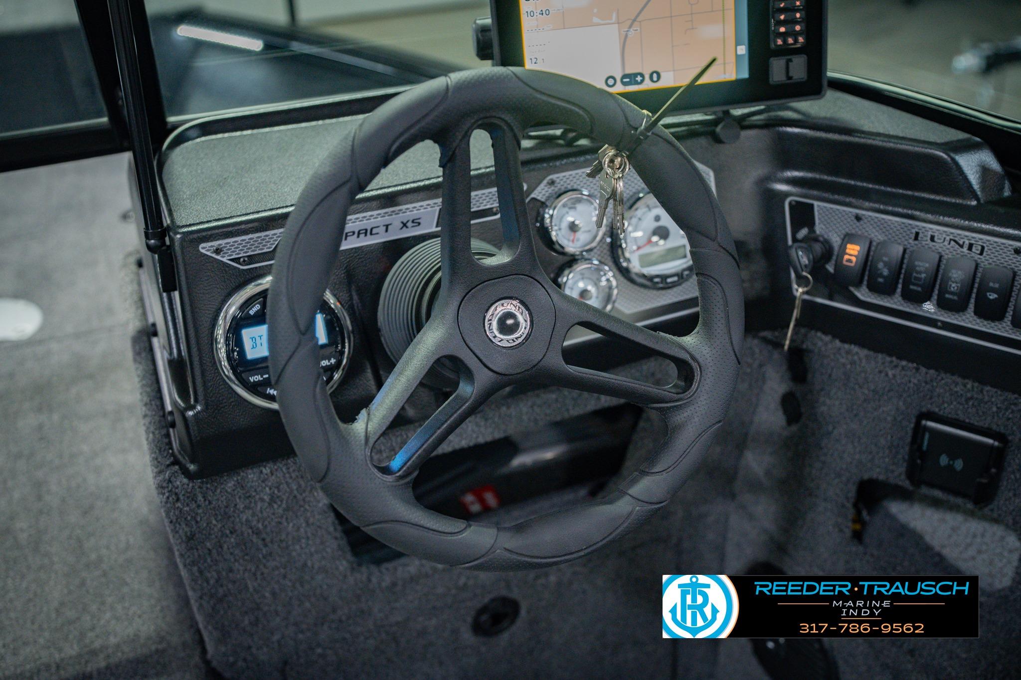 Steering wheel and dashboard of 2026 Lund 1775 Impact XS boat.