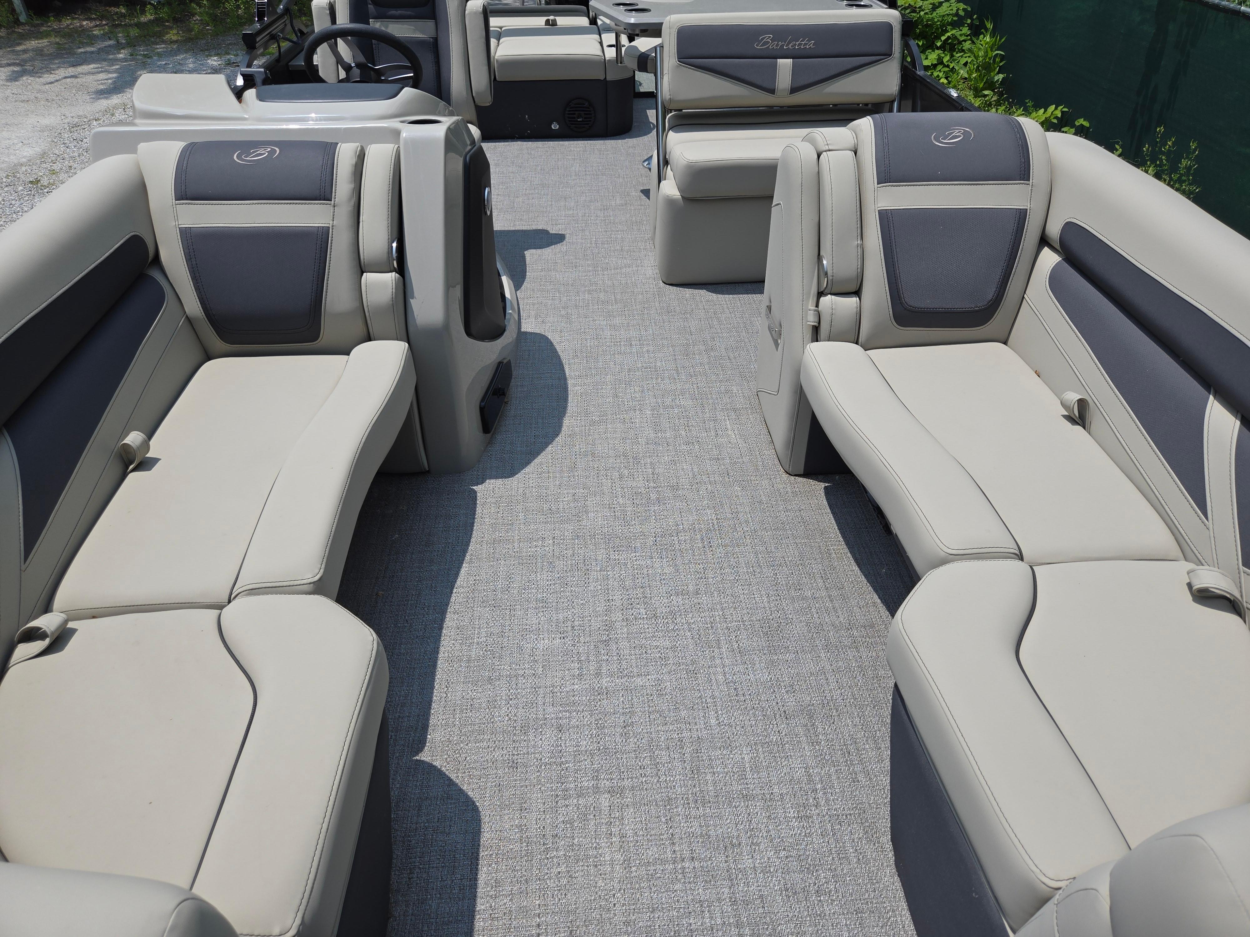 2023 Barletta Cabrio 24UE pontoon boat interior with plush seating and modern design.