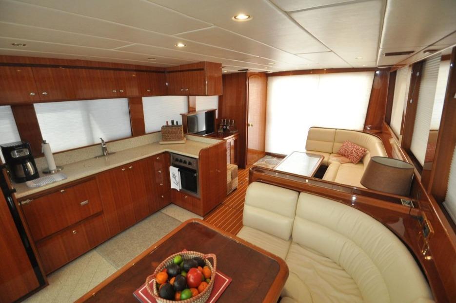 Luxurious interior of 2004 Hampton F/B Cruiser with kitchen and seating area.