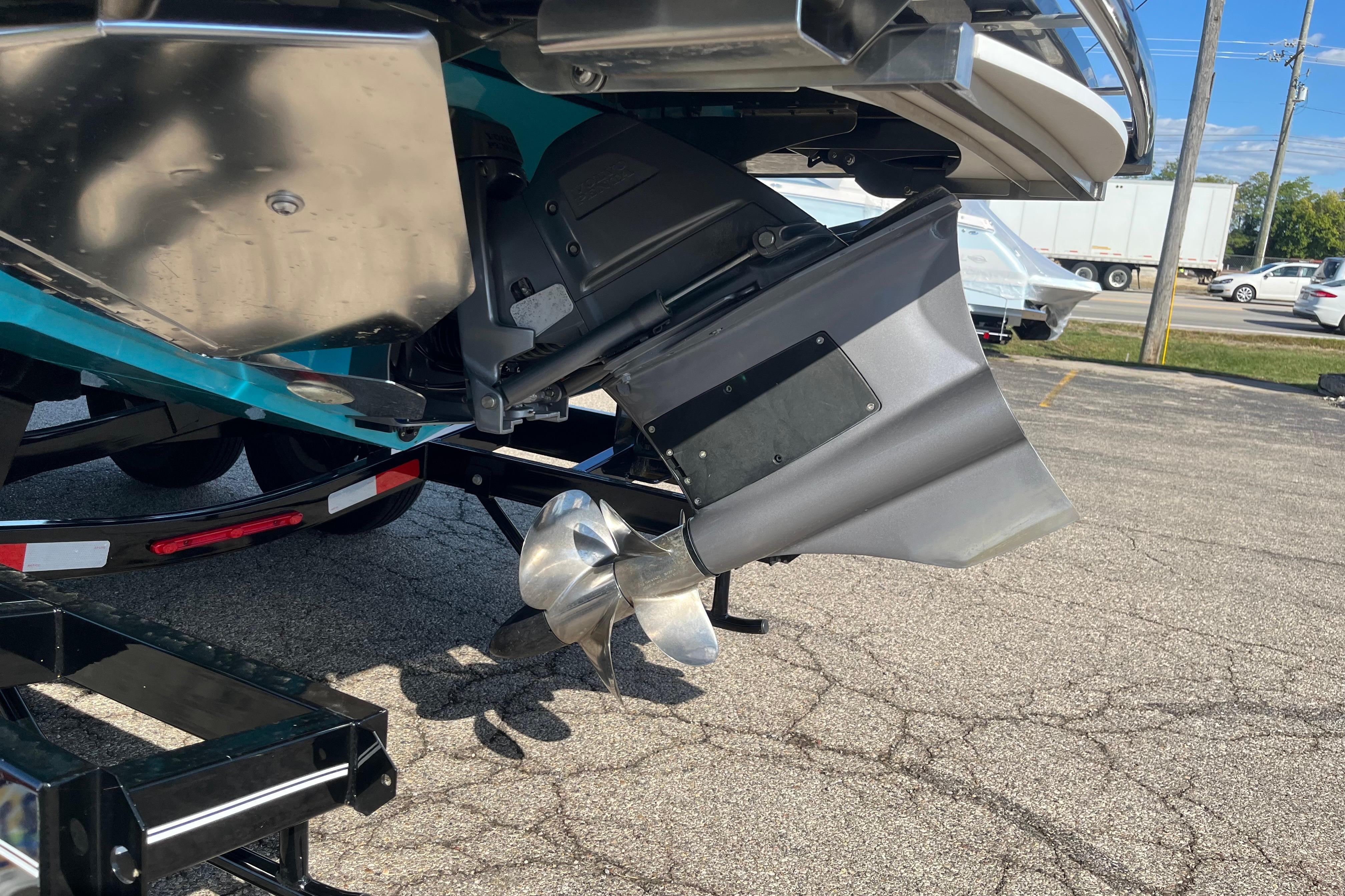 2024 Regal LS9 Surf boat propeller and stern detail in parking lot.