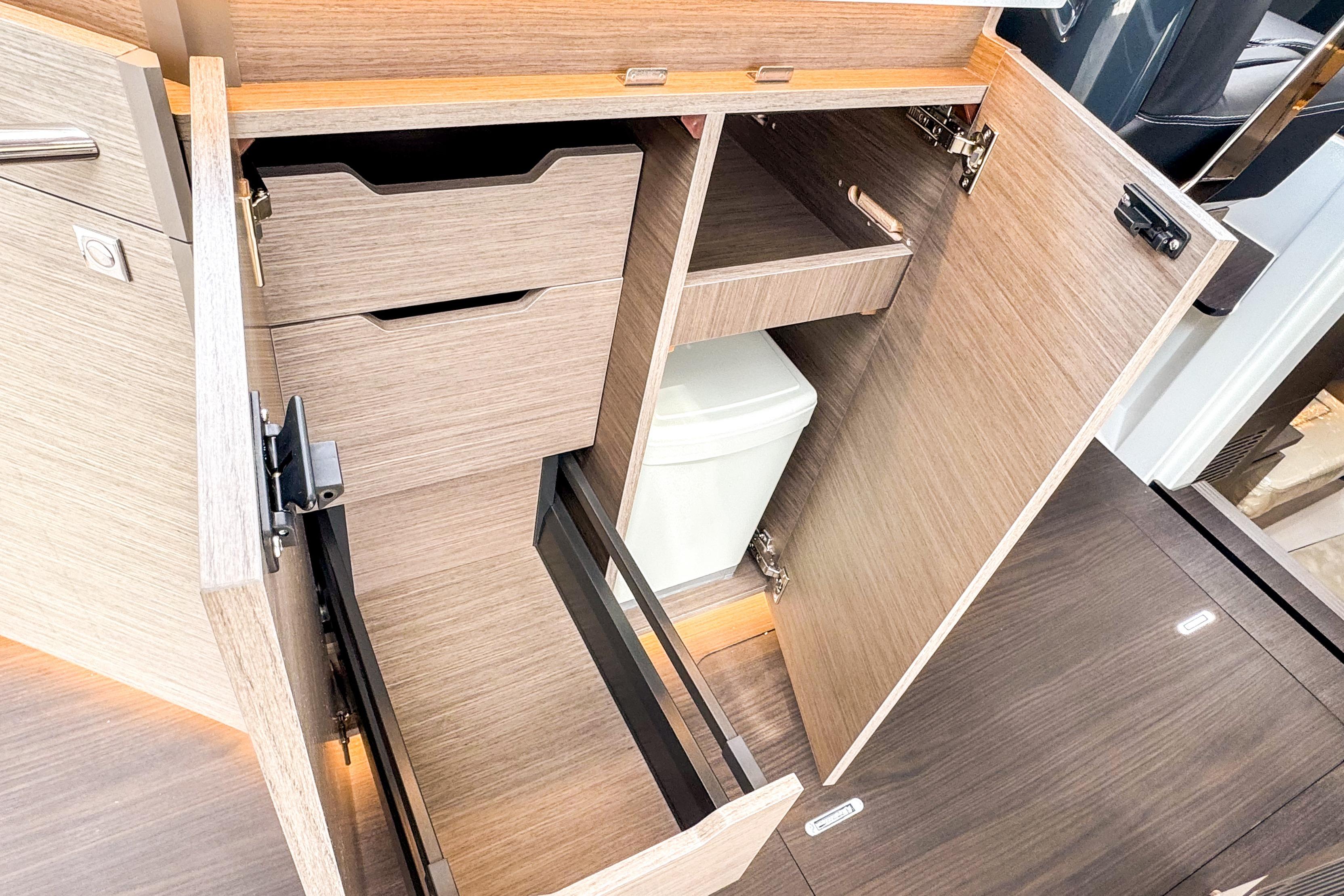 Interior storage compartments of 2025 Wellcraft 38 Explorer boat, featuring modern cabinetry and efficient design.