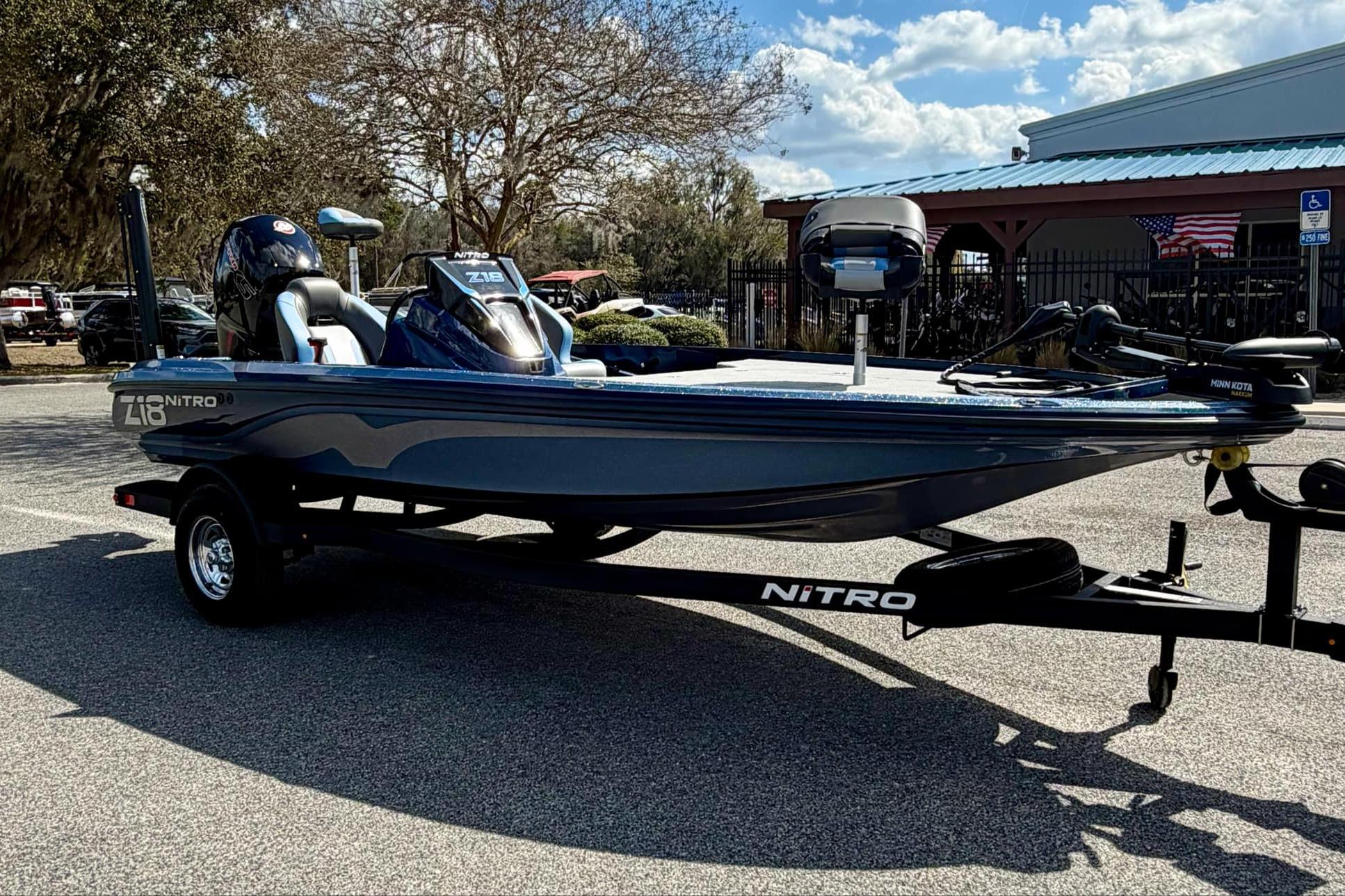 2026 Nitro Z18 boat on trailer, parked outdoors under a clear sky.