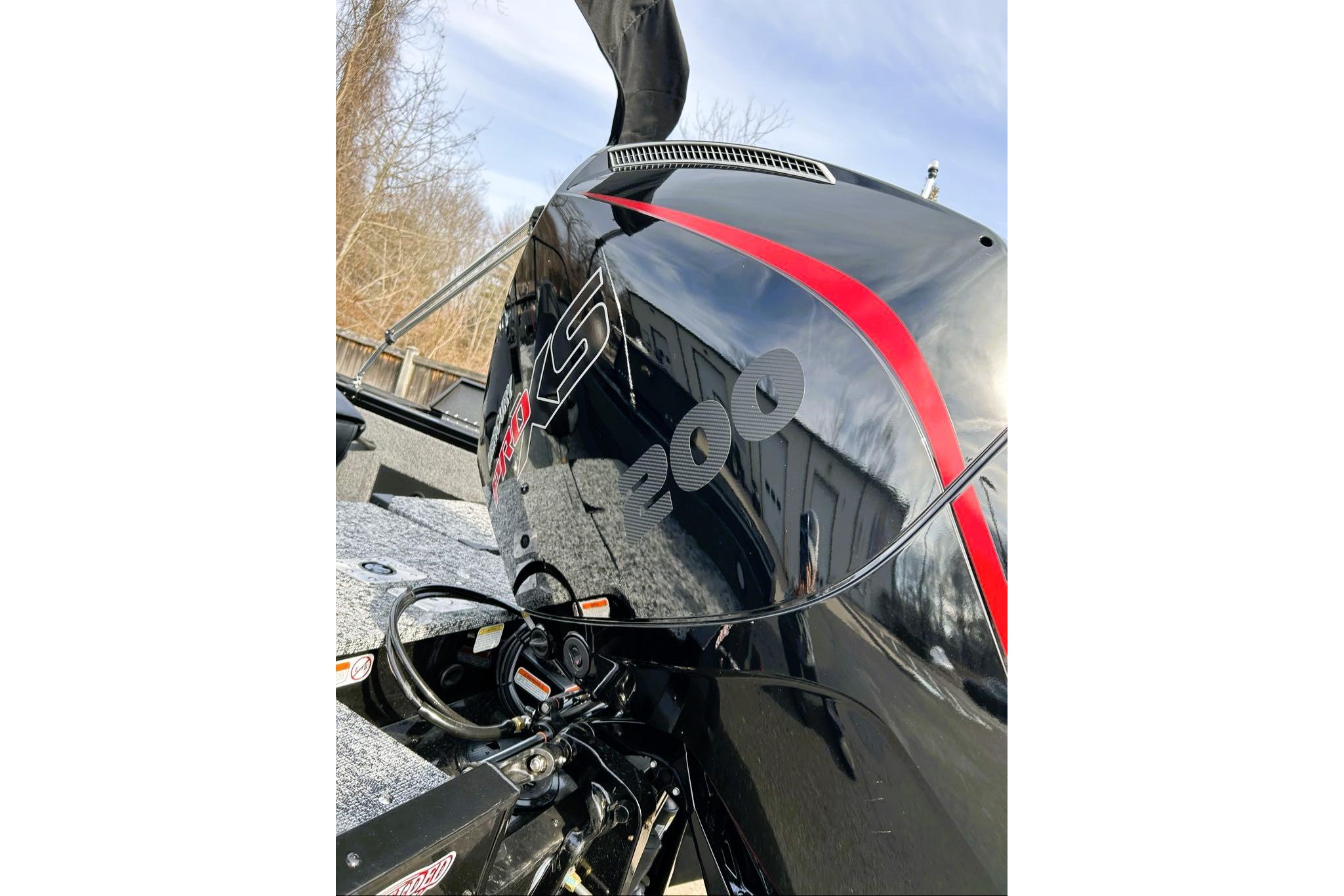 2026 Tracker Targa V-18 Combo boat engine with sleek black and red design.