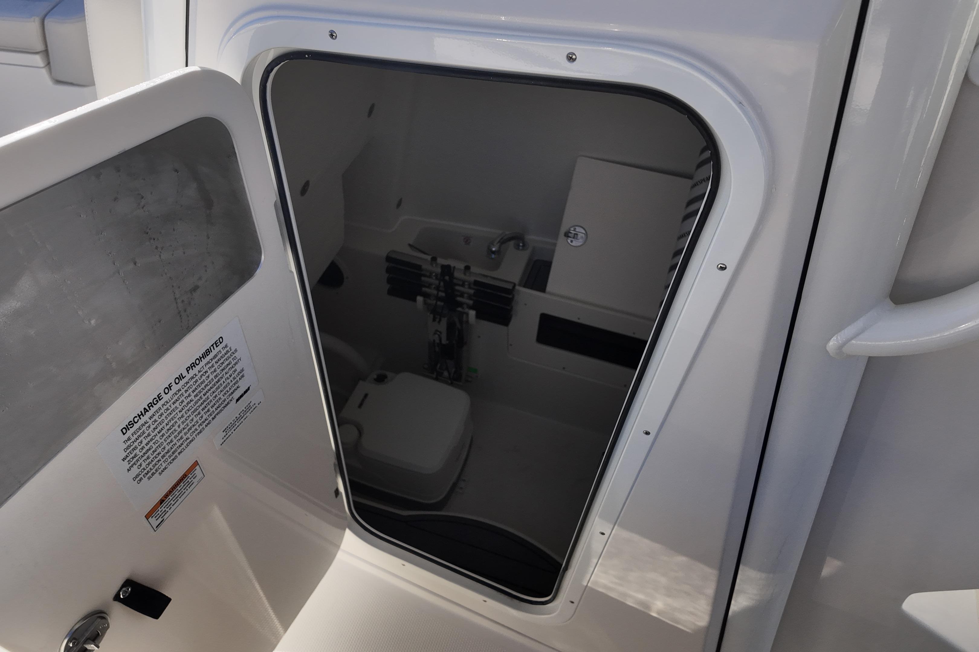 Interior view of 2026 Sailfish 272 CC boat's compact restroom.