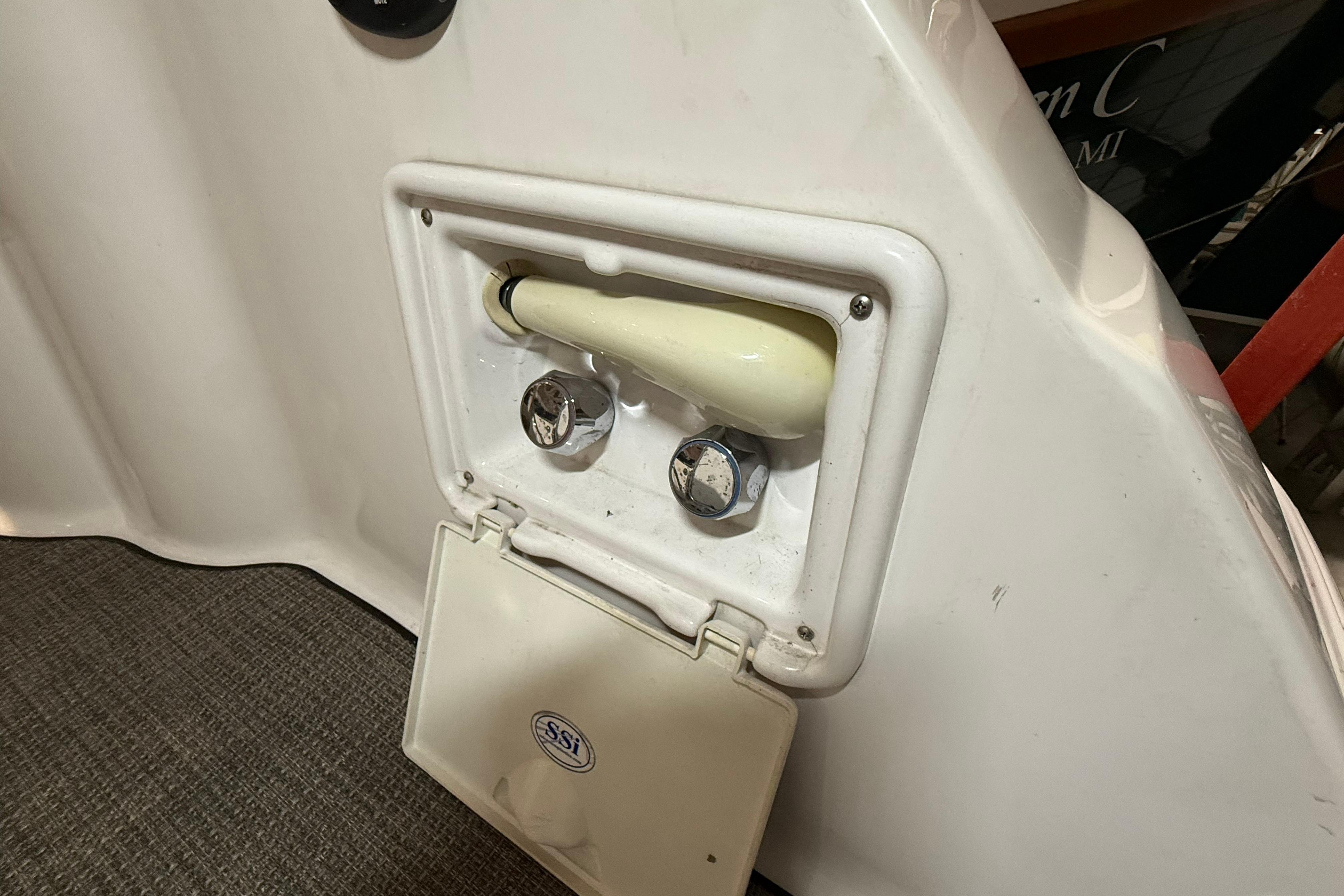 2007 Regal Commodore 3760 IO boat shower compartment with controls and cover.