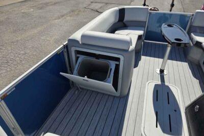 2026 SunCatcher Select 322RC boat interior with seating and storage compartment.