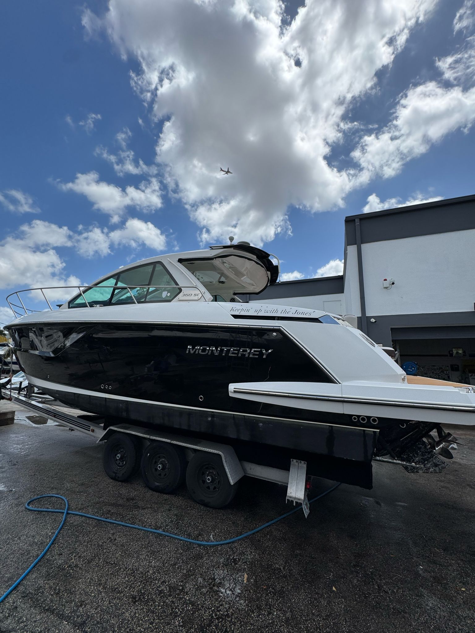 2015 Monterey 360 Sport Coupe on trailer under cloudy sky.