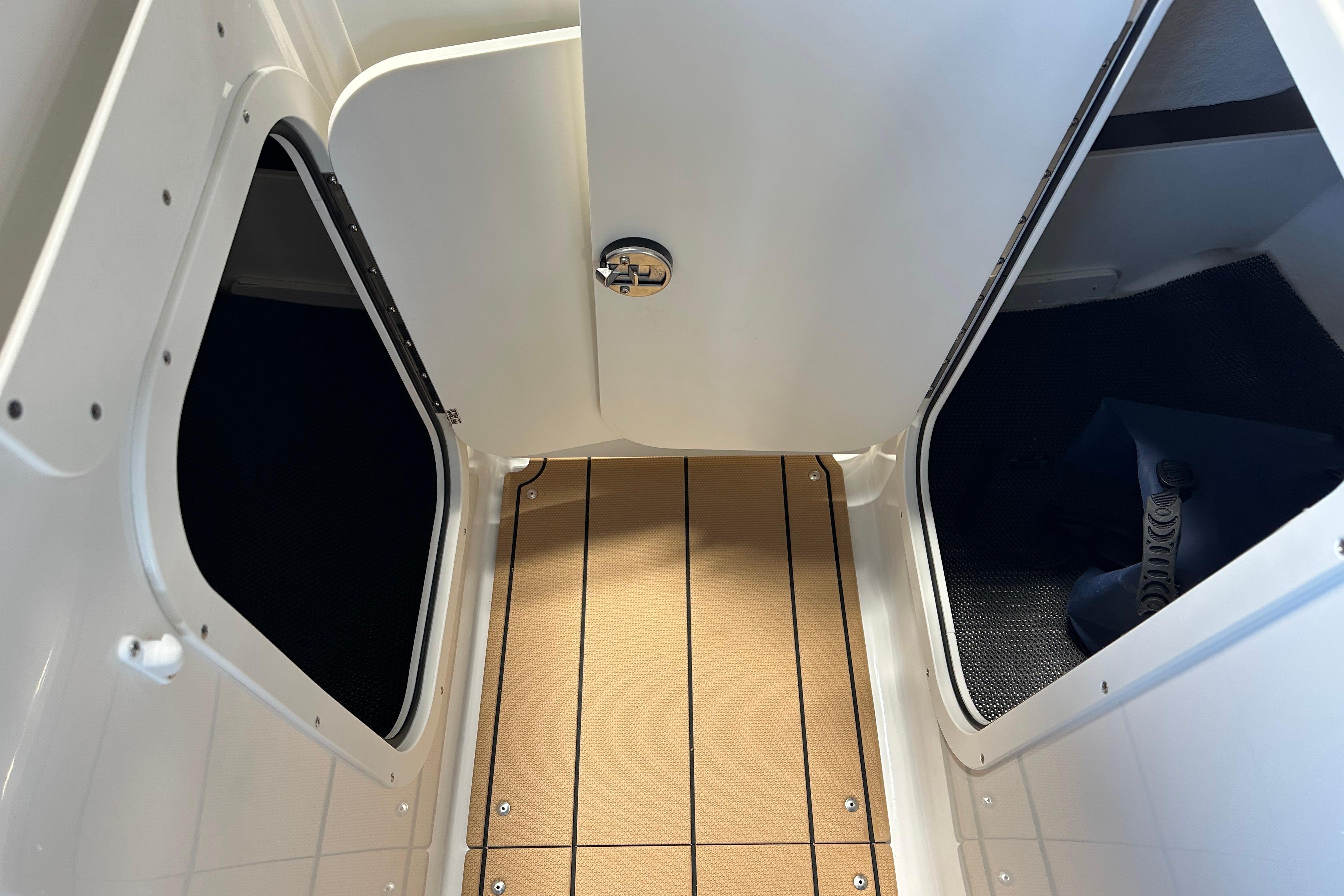 Interior of 2026 Chaparral 23 SSi with wooden flooring.