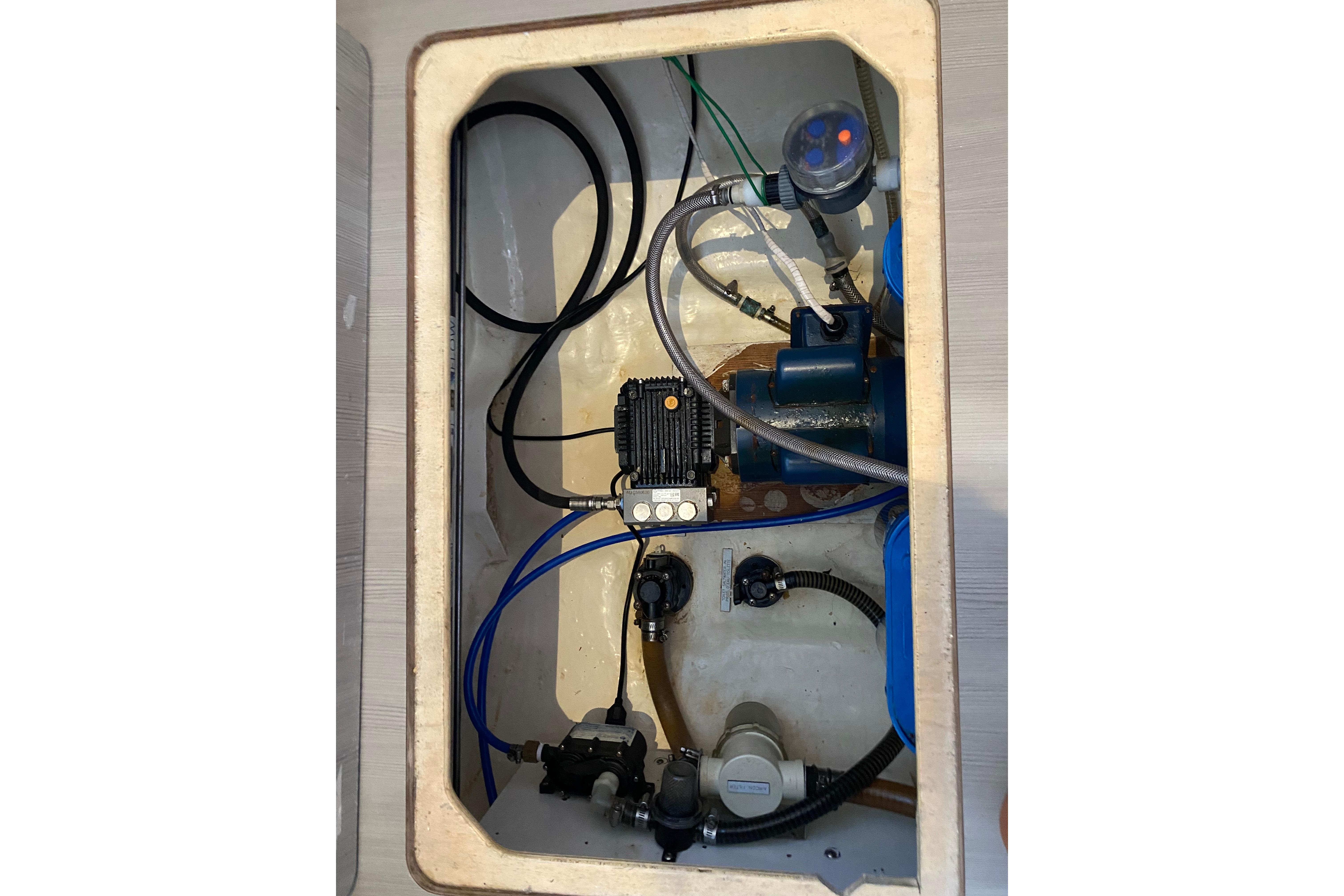 Engine compartment of a 2017 Leopard 40 yacht, showcasing mechanical components and wiring.