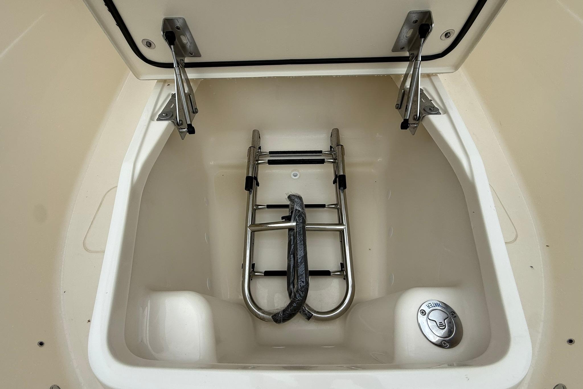 2026 Scout 260 LXF boat compartment with foldable ladder and water access.