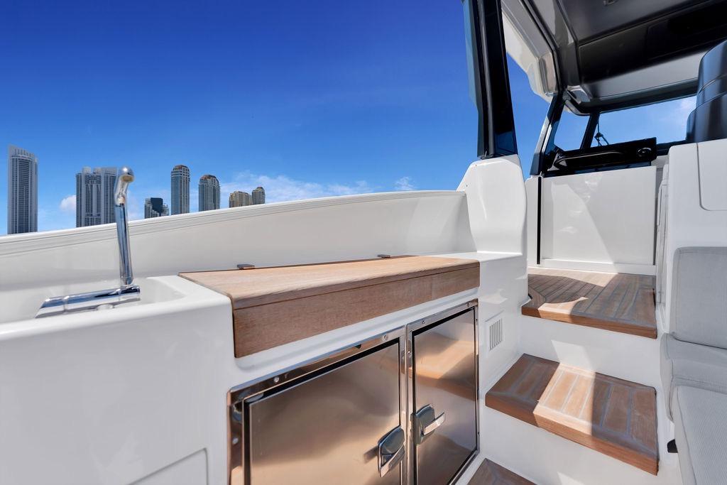 2021 Bluegame BG 42 yacht interior with sleek design and city skyline view.