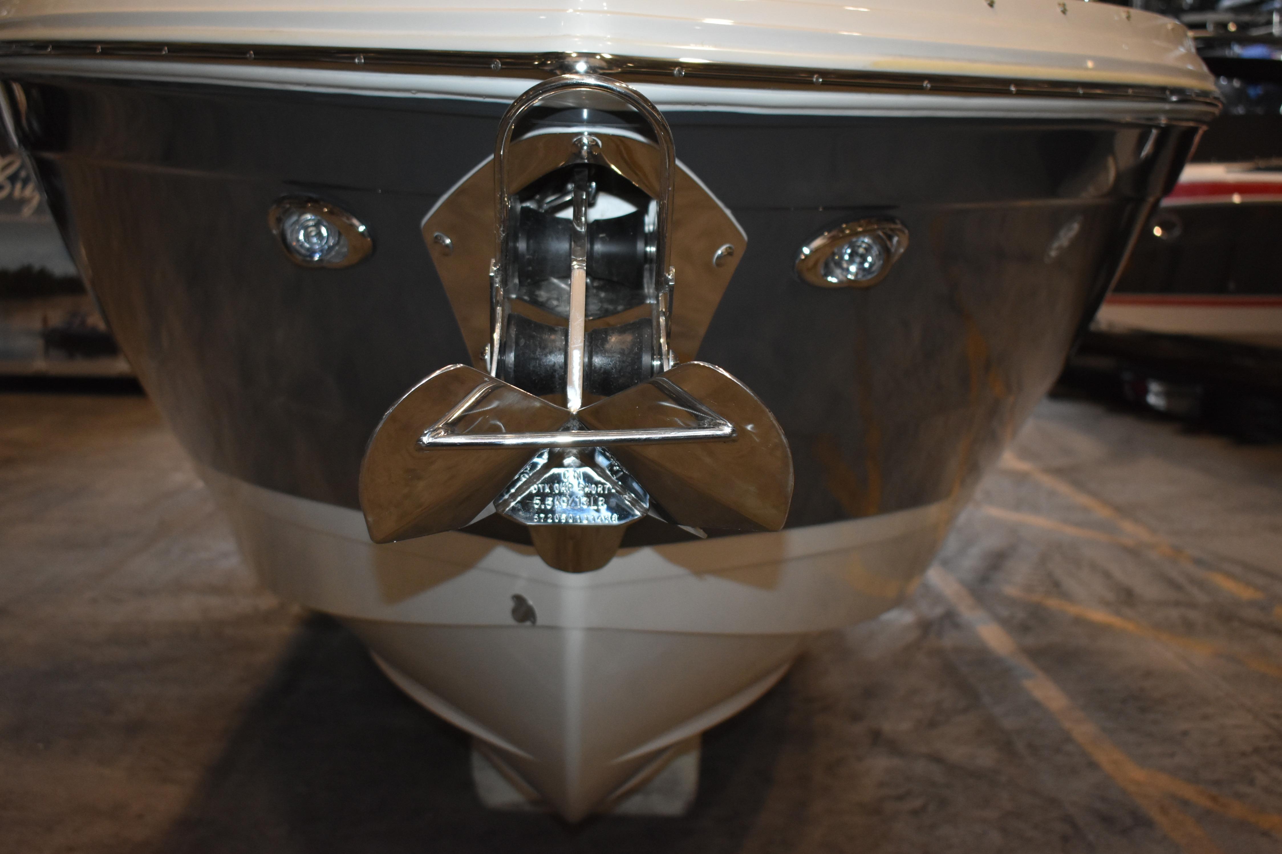 Front view of 2023 Cobalt R8 boat with polished anchor and sleek design.