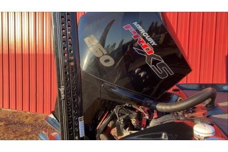 2020 Bass Cat Eyra Premium with Mercury Pro XS engine against red background.