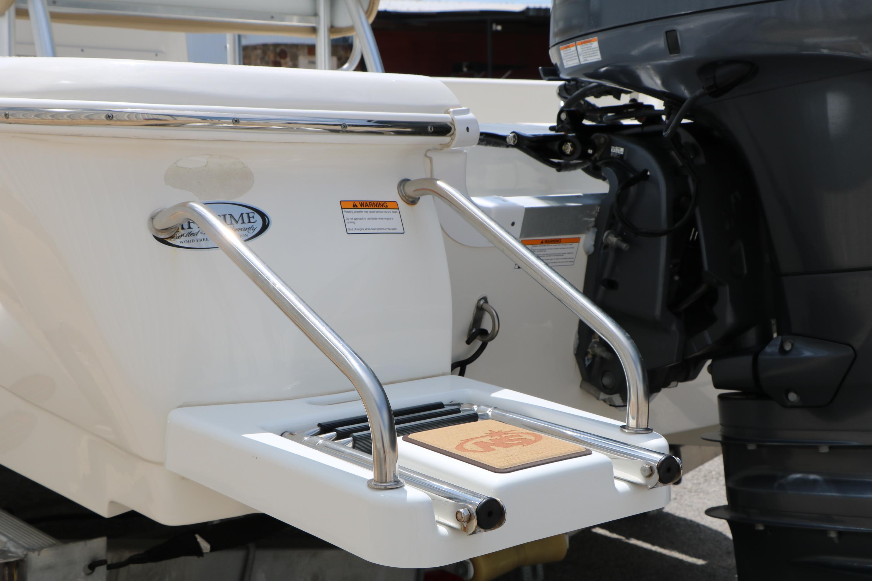2020 NauticStar 2140 Sport boat with swim platform and outboard motor.