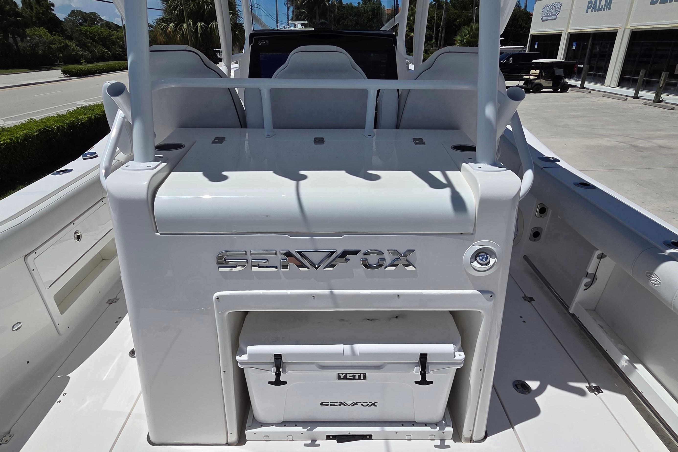 2021 Sea Fox 328 Commander boat interior with Yeti cooler and seating area.