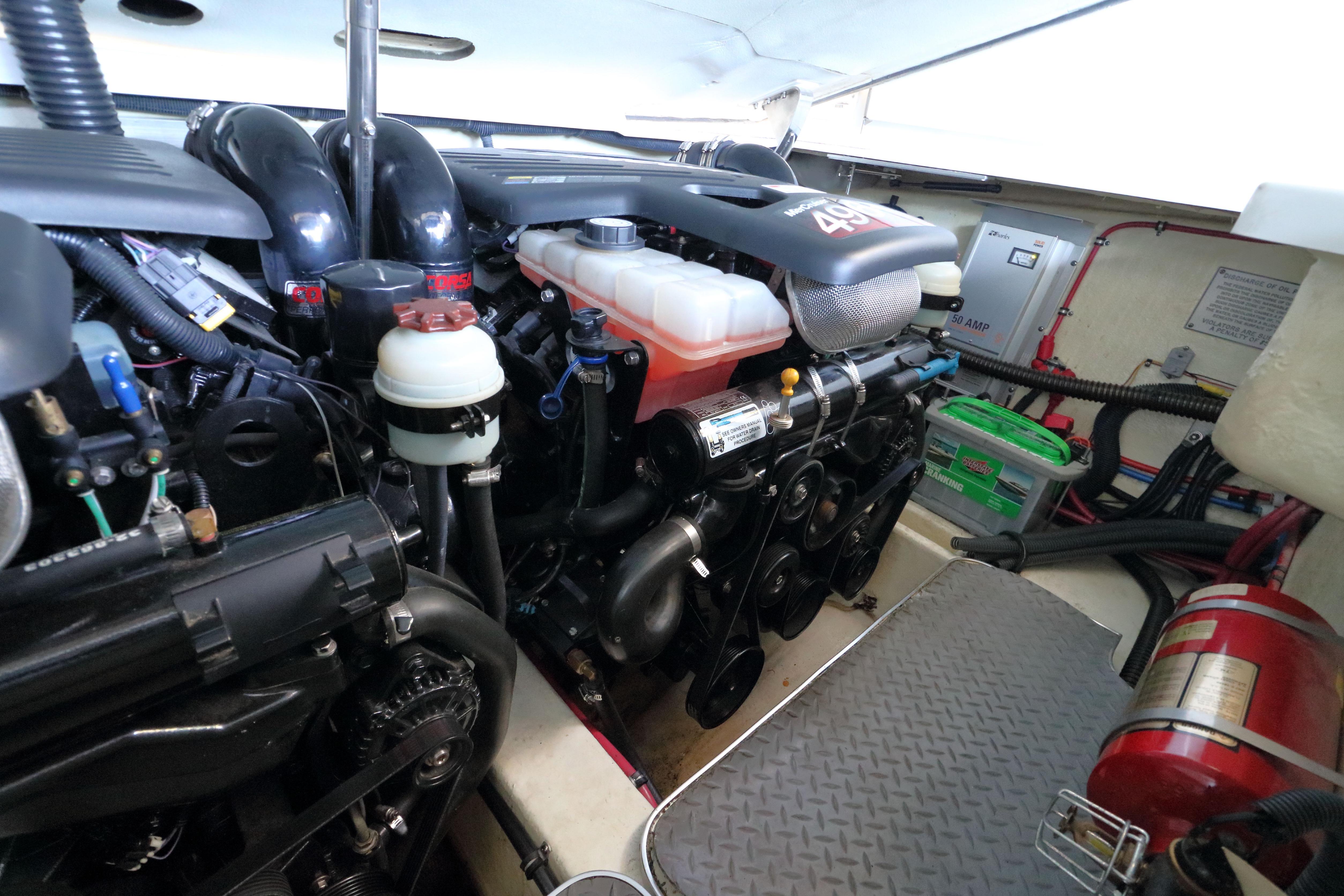 Engine compartment of a 2006 Formula 330 Sun Sport boat, showcasing mechanical components.