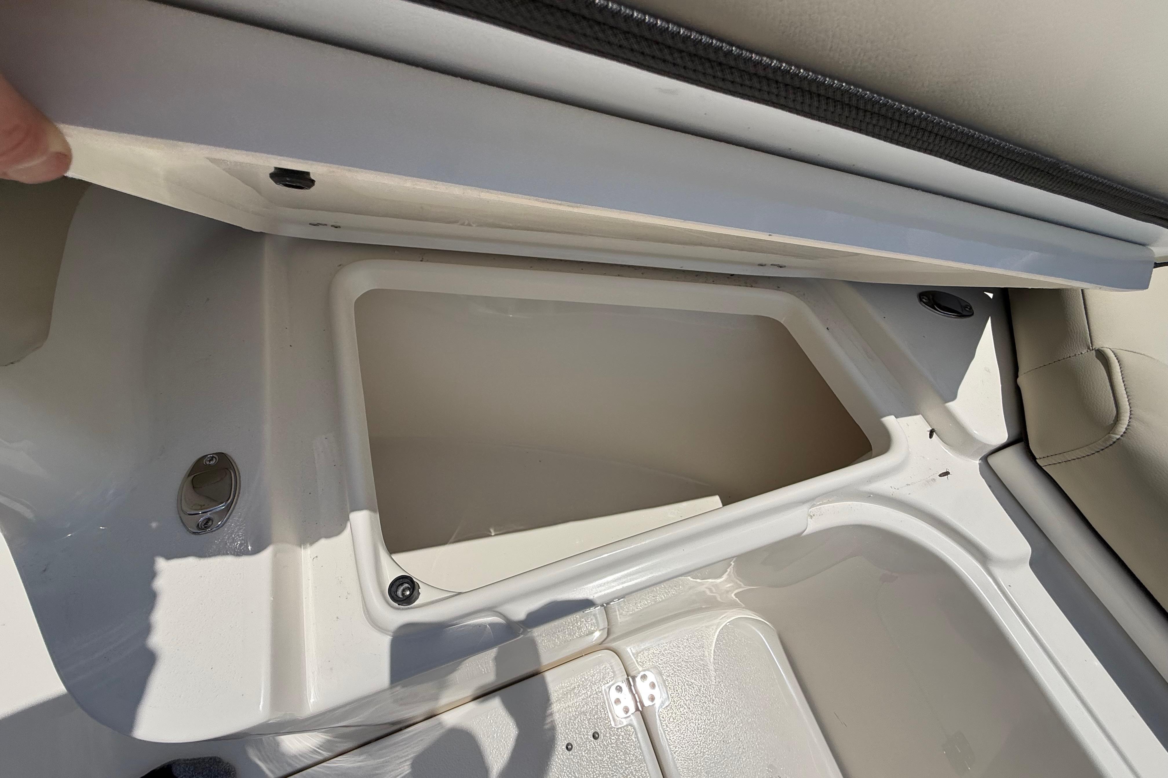 Storage compartment of 2027 Key West 249 FS boat, open and empty.