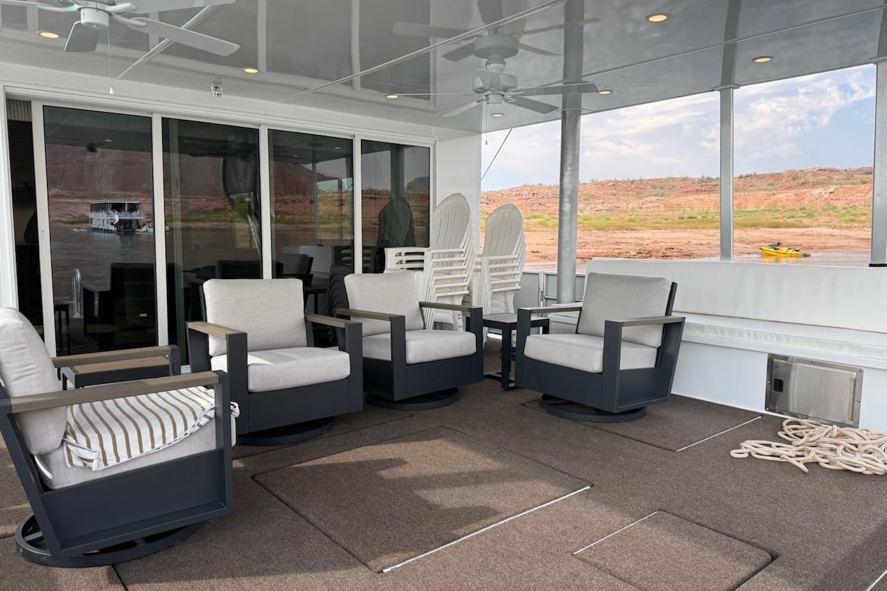 Luxurious 2025 Sumerset Excellence houseboat deck with comfortable seating and scenic views.