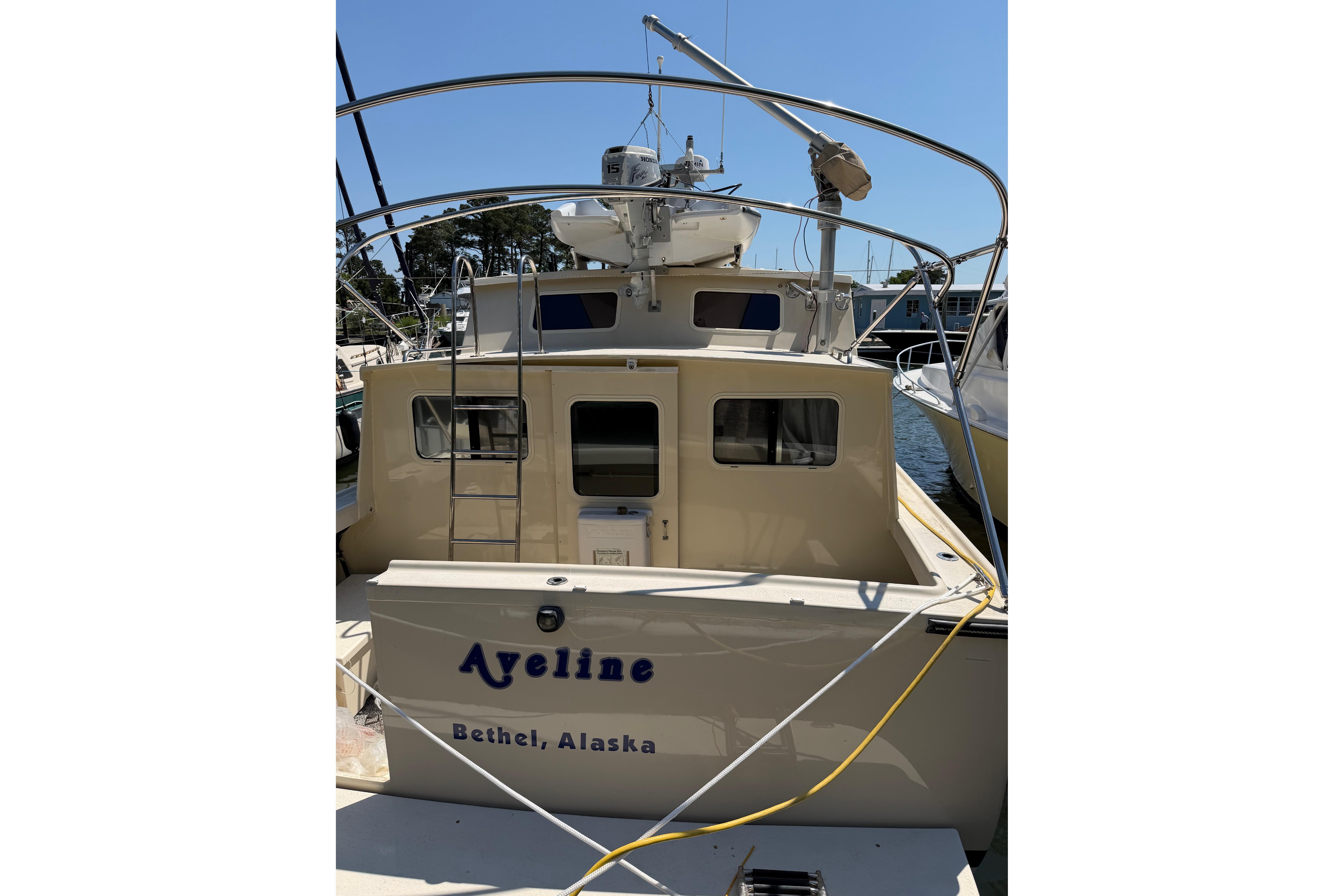 1997 Rosborough Trawler docked, featuring "Ayeline" from Bethel, Alaska, with ladder and equipment.