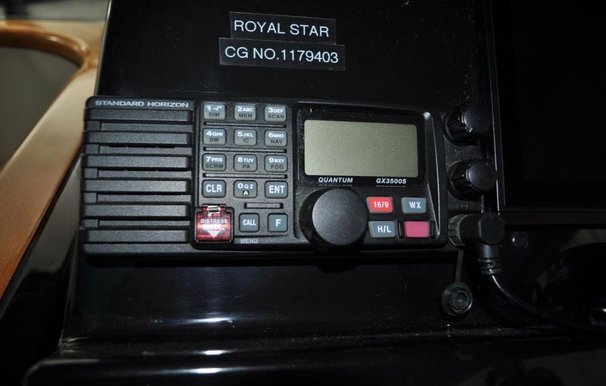 Radio on a boat labeled "Royal Star" with a registration number.