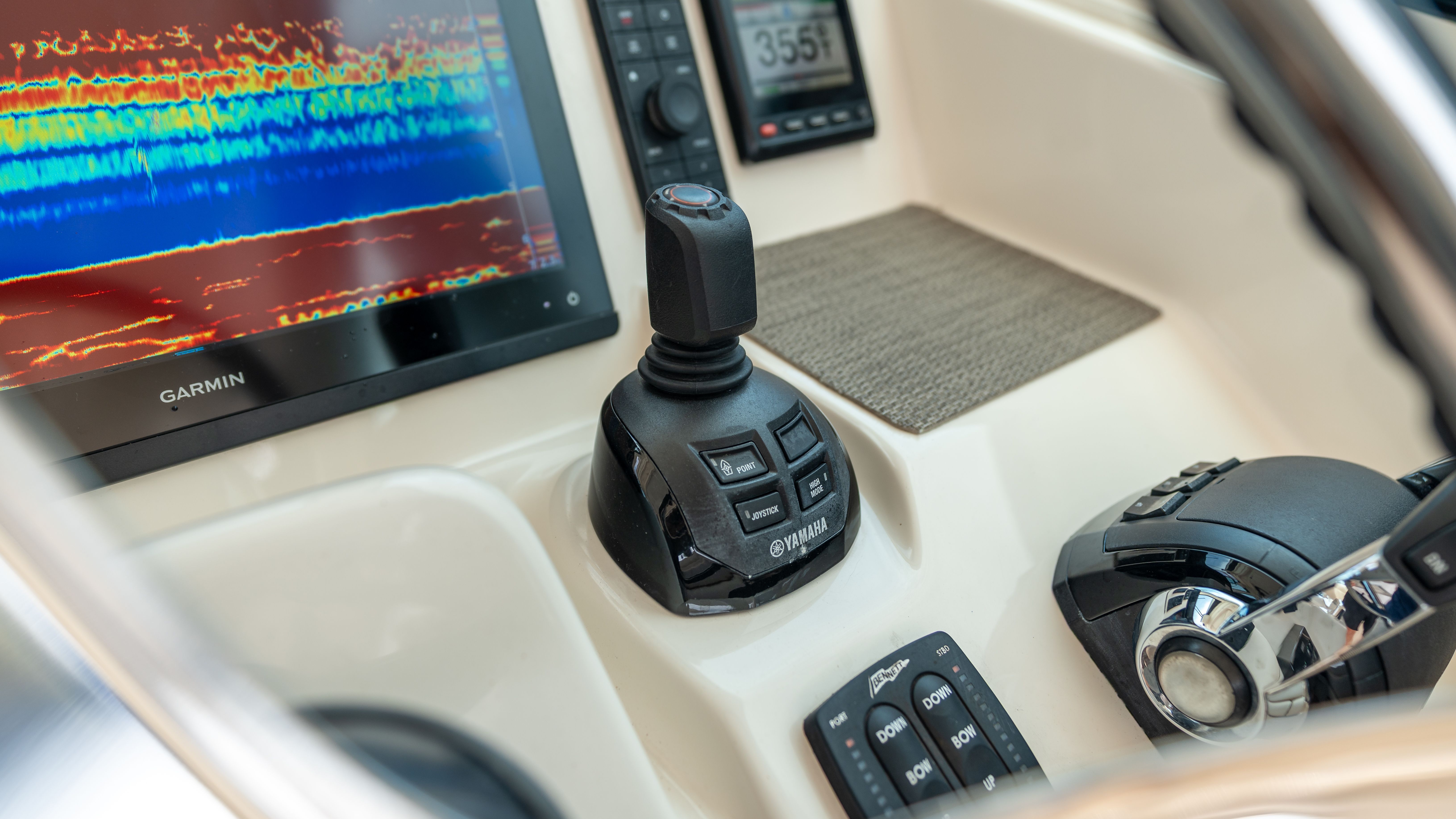 Close-up of the helm of a Grady-White 375 Freedom with modern controls and displays.