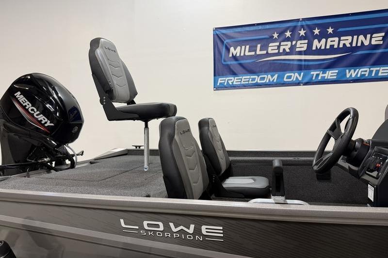 2026 Lowe Skorpion 16 boat interior with Mercury engine at Miller's Marine showroom.