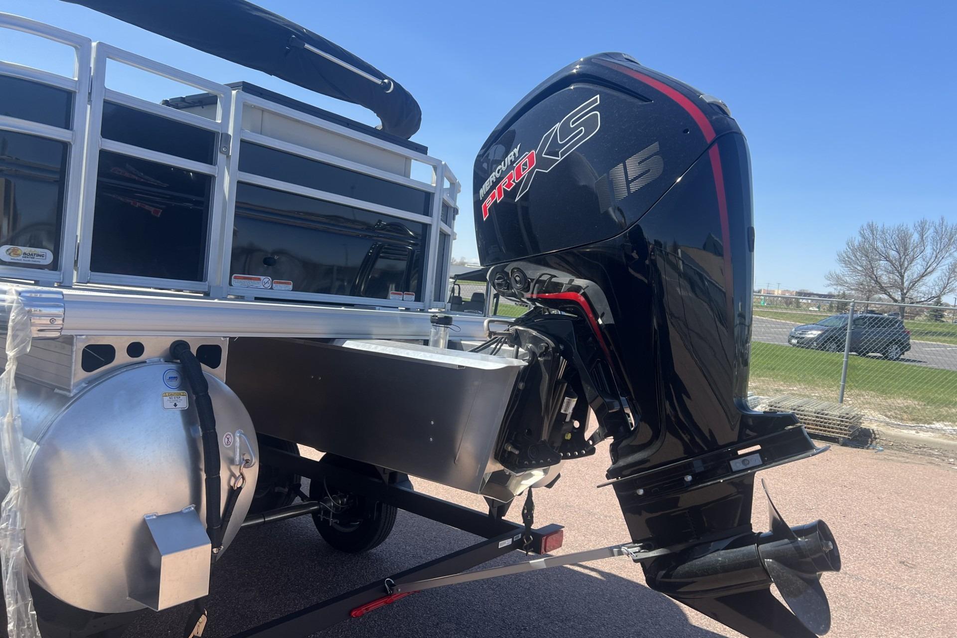 2026 Sun Tracker Fishin' Barge 20 DLX with Mercury Pro XS outboard motor.