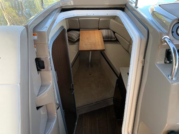 Interior of the 2017 Regal 26 Express with seating area and table.