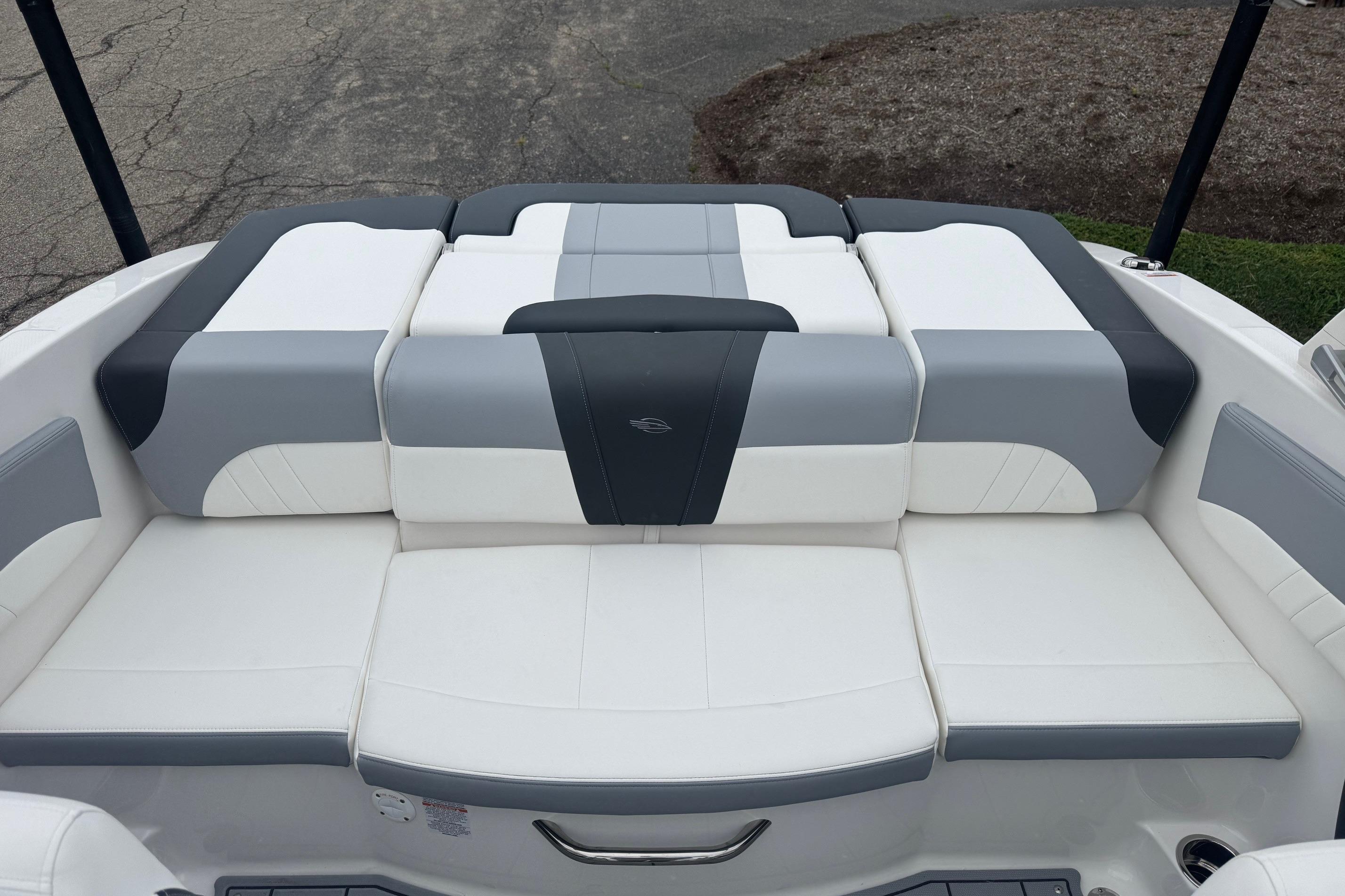 2026 Chaparral 21 SSi boat interior with white and gray cushioned seating.