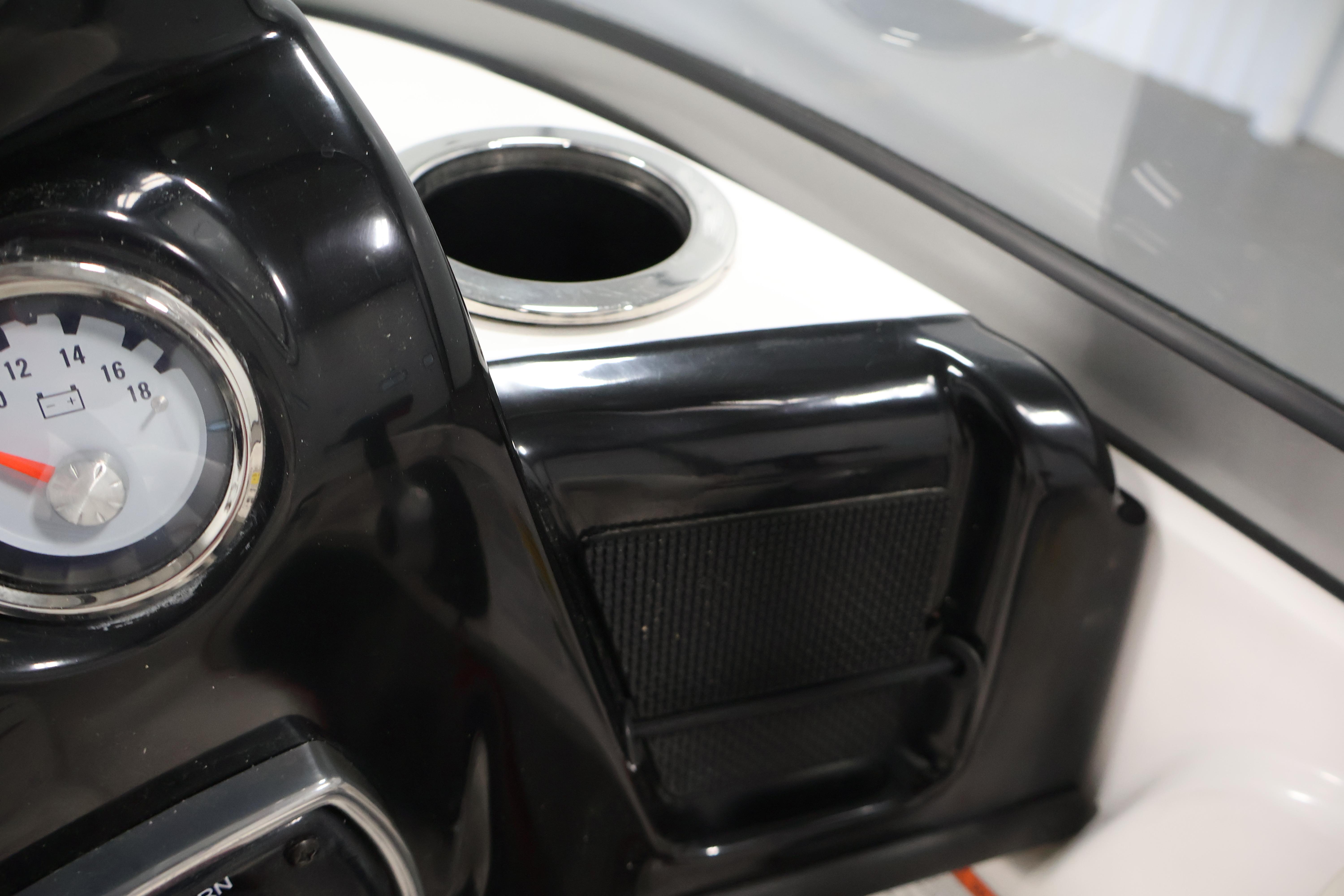 Dashboard of 2019 Nitro Z19 Sport boat with gauge and cup holder.