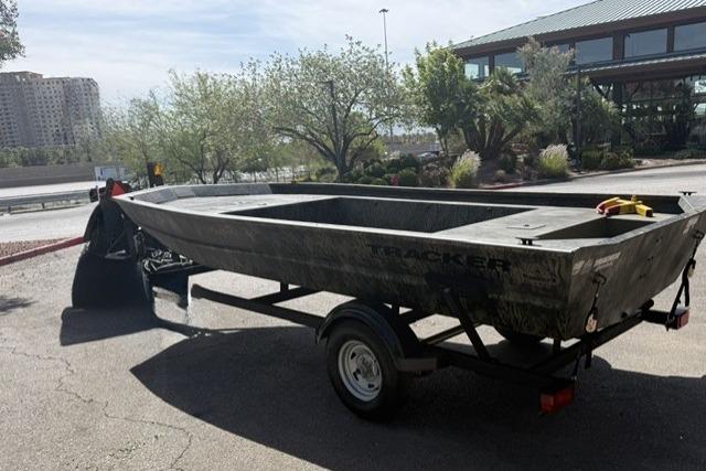 2026 Tracker Grizzly 1754 Utility boat on trailer in outdoor setting.