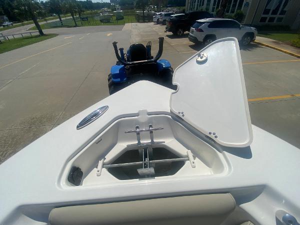 2024 Key West 239 FS boat anchor compartment with open lid.