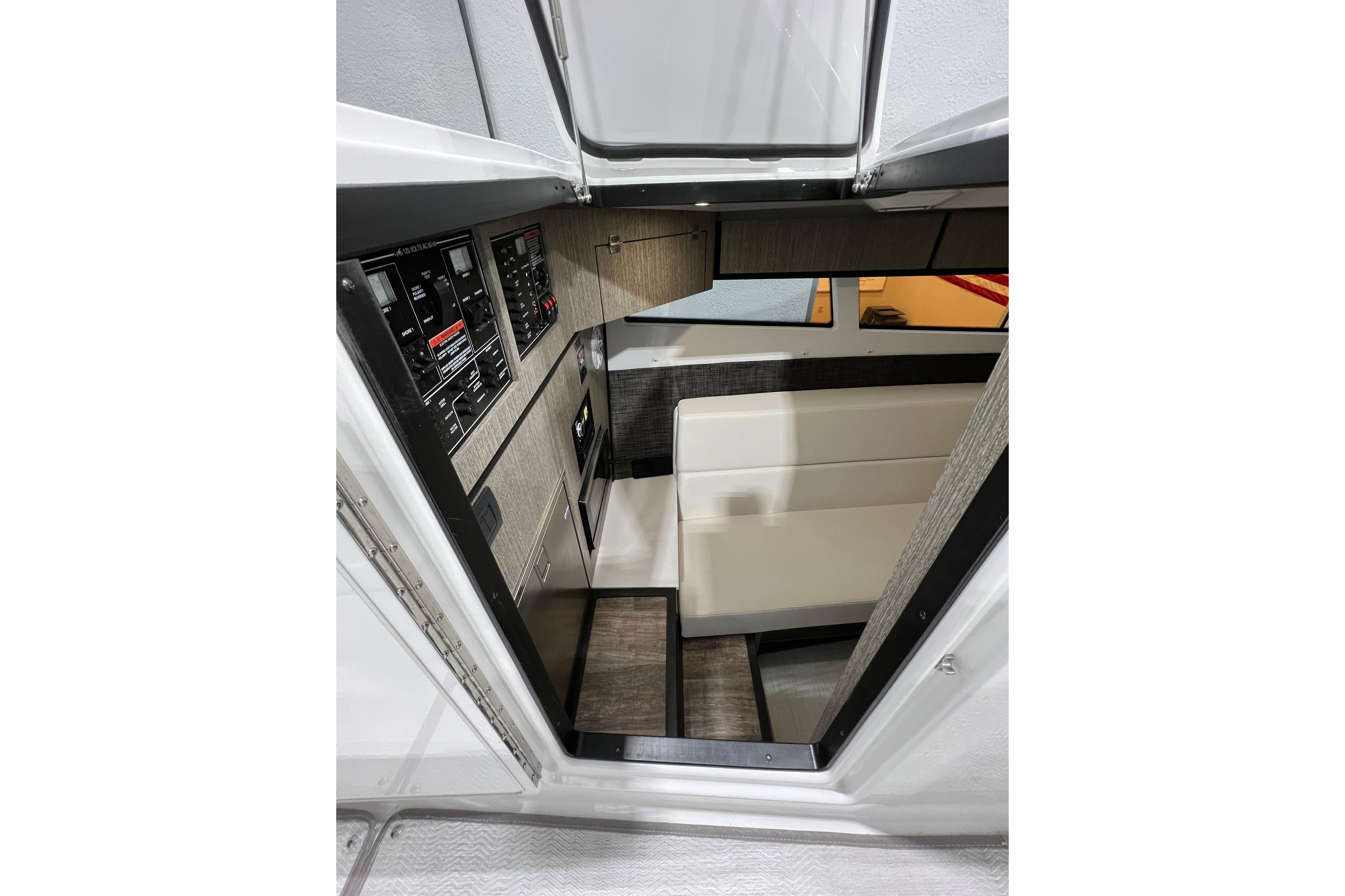 Interior view of 2023 Monterey 378SS Super Sport boat, featuring seating and control panels.